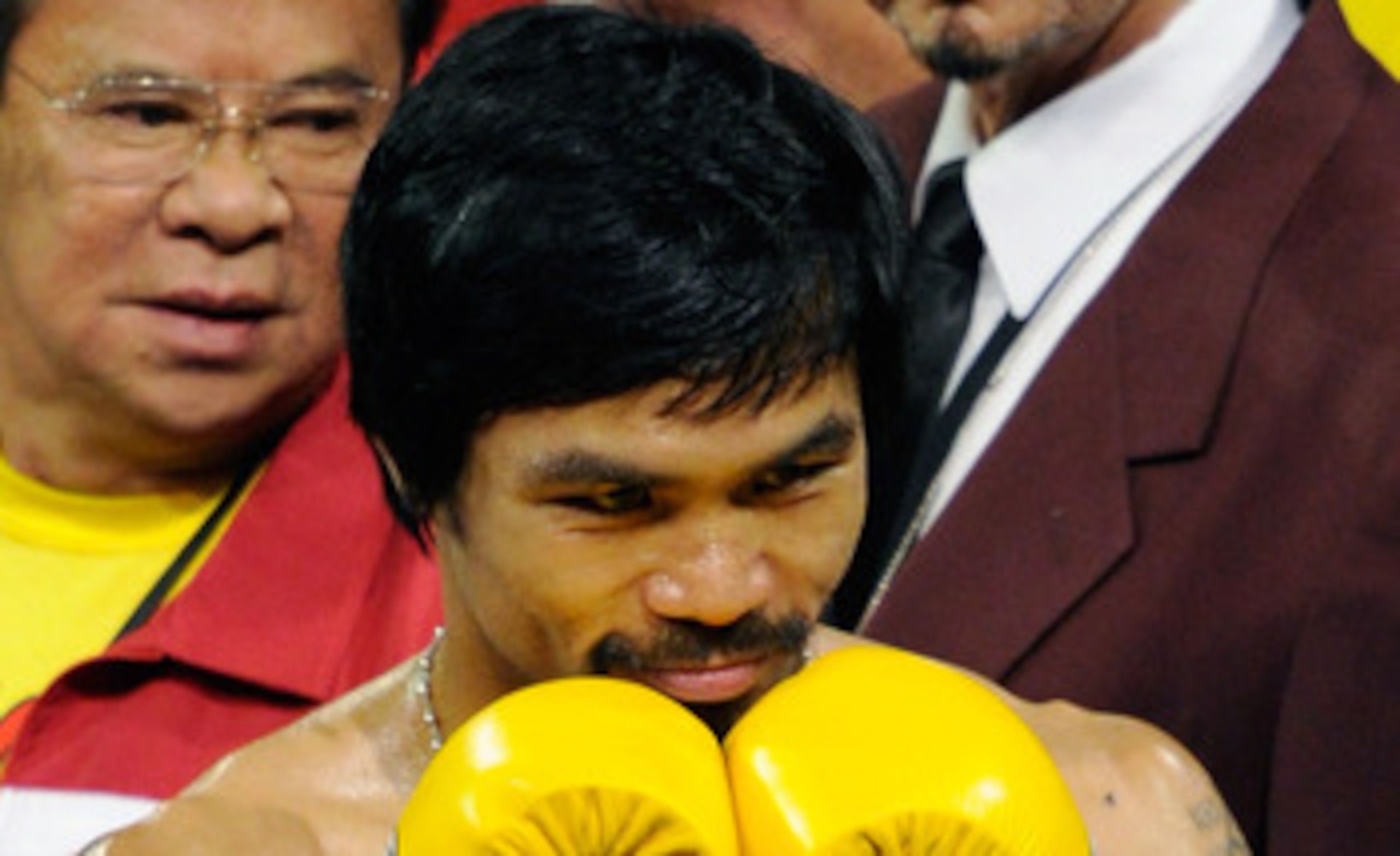LAS VEGAS, NV - MAY 07:  Boxer Manny Pacquiao acknowledges fans before his WBO welterweight title fight against Shane Mosley at the MGM Grand Garden Arena May 7, 2011 in Las Vegas, Nevada. Pacquiao, who retained his title by unanimous decision, wore yello