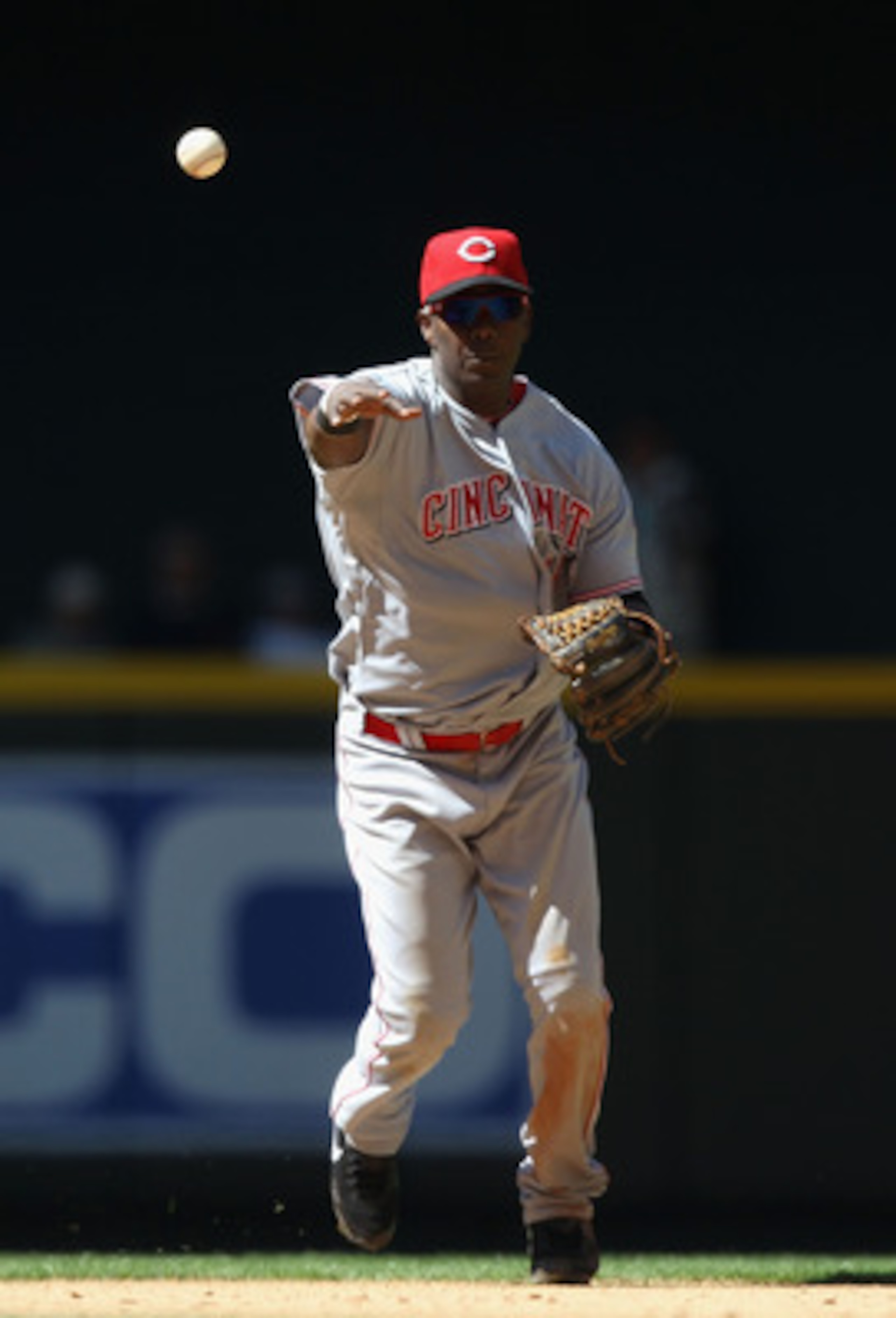 PHOENIX, AZ - APRIL 10:  Iniflder Edgar Renteria #16 of the Cincinnati Reds fields a ground ball out against the Arizona Diamondbacks during the Major League Baseball game at Chase Field on April 10, 2011 in Phoenix, Arizona.  The Diamondbacks defeated th