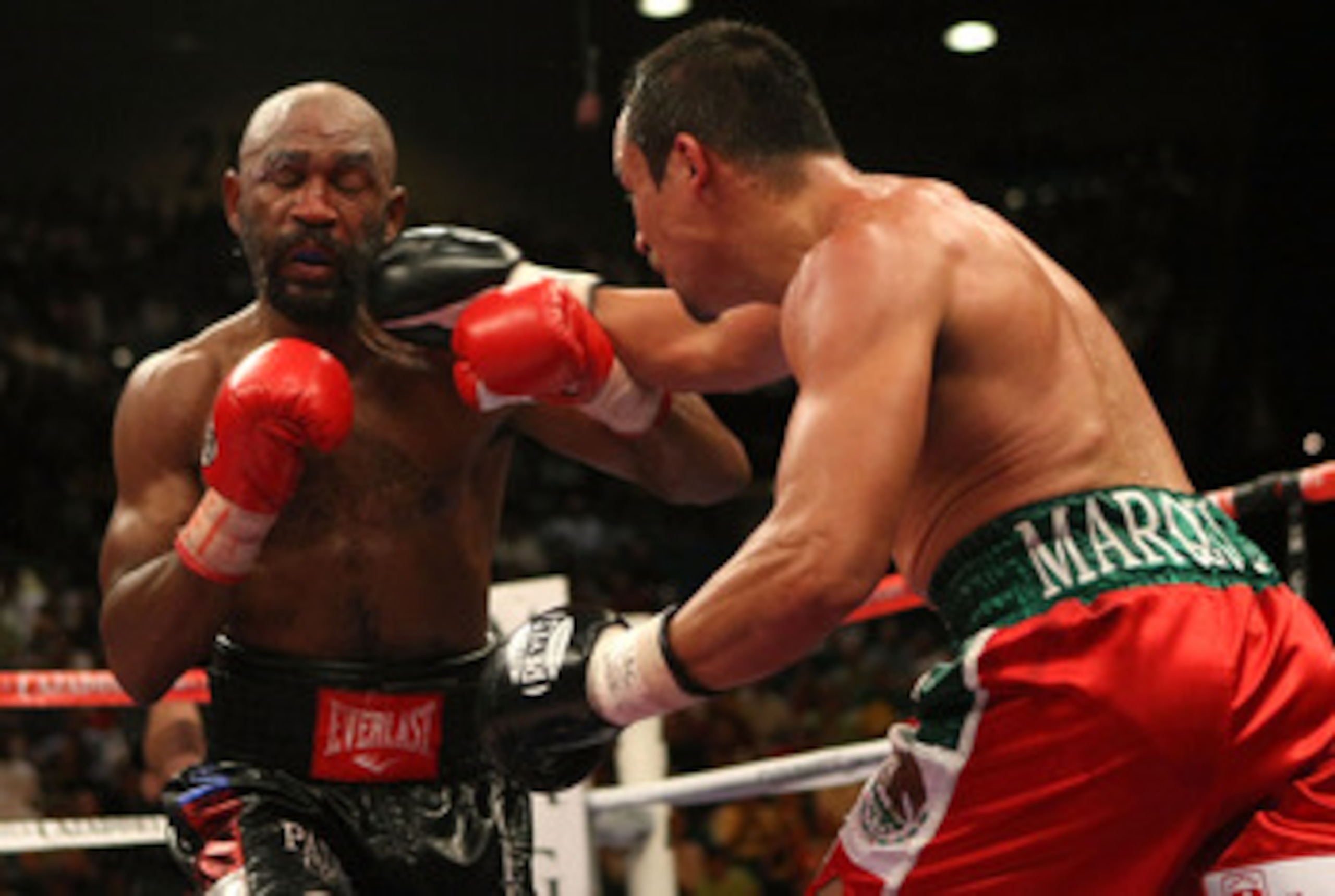 LAS VEGAS - SEPTEMBER 13:  Joel Casamayor (L) is hit by Juan Manuel Marquez during their bout at the MGM Grand Garden Arena September 13, 2008 in Las Vegas, Nevada. Casamayor defeated Marquez with an 11th round knockout. (Photo by Jed Jacobsohn/Getty Imag