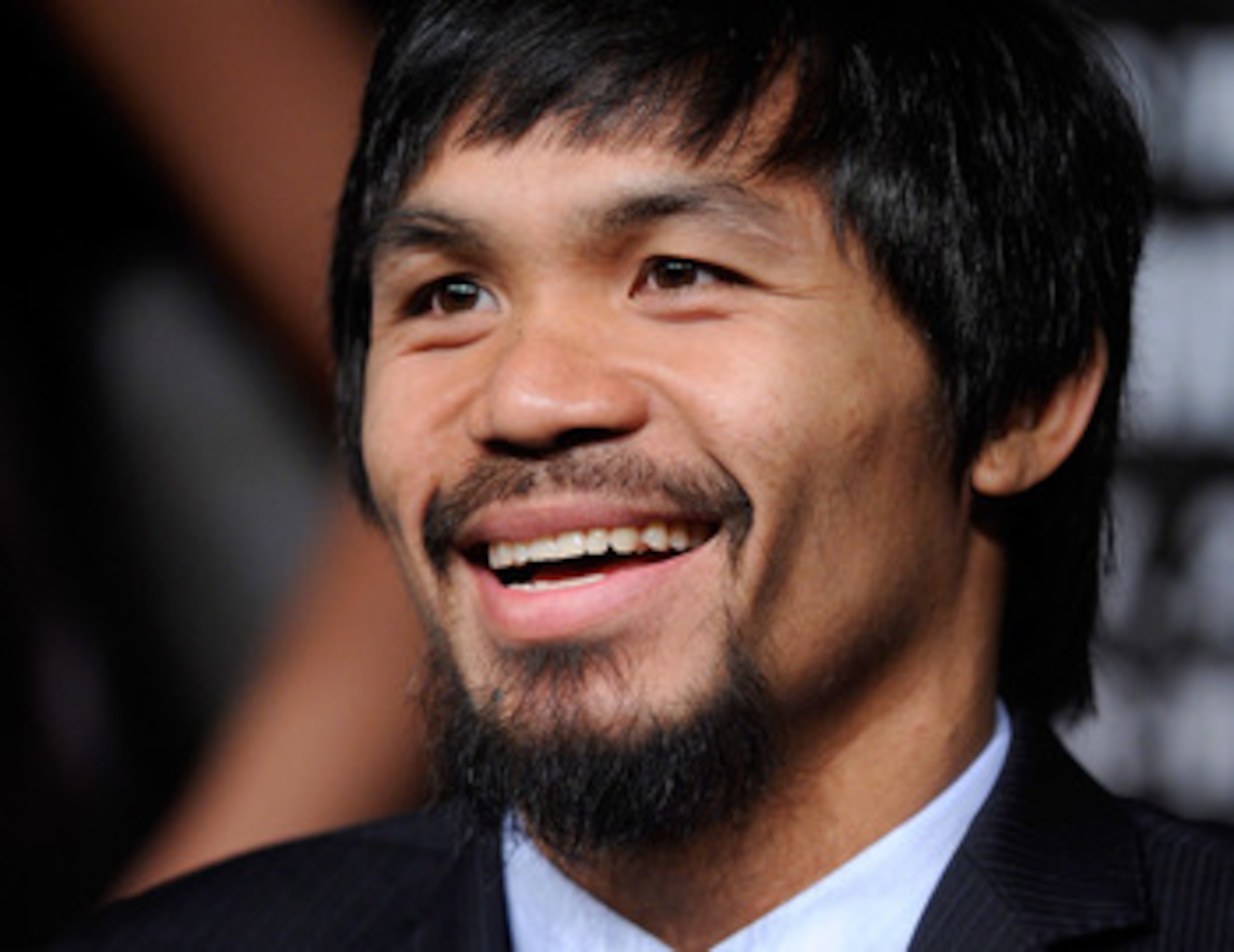 LAS VEGAS, NV - MAY 04:  Boxer Manny Pacquiao smiles during the final news conference for his bout against Shane Mosley at the MGM Grand Hotel/Casino May 4, 2011 in Las Vegas, Nevada. Pacquiao will defend his WBO welterweight title against Mosley on May 7