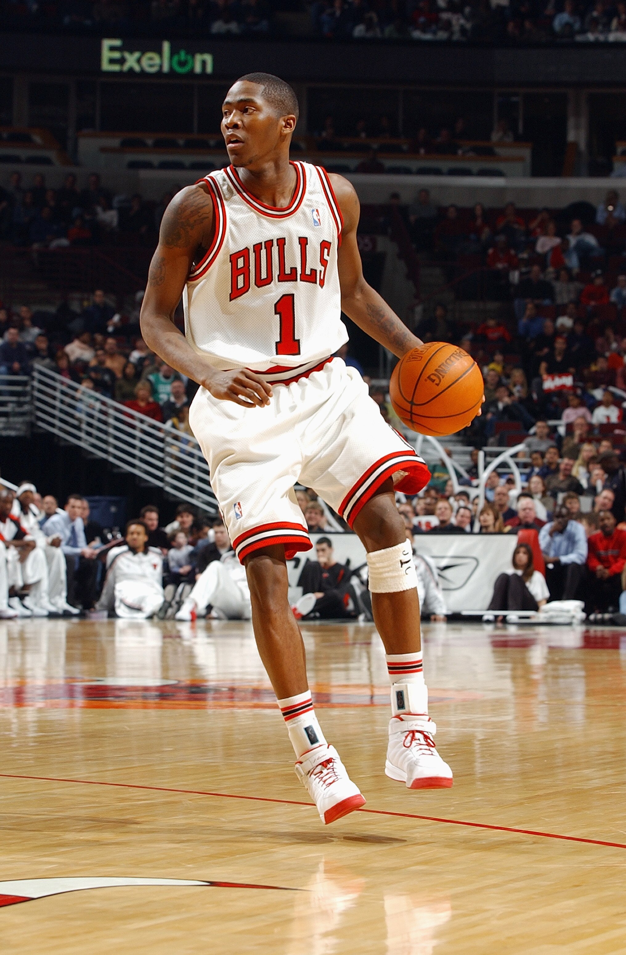 CHICAGO - FEBRUARY 12:  Jamal Crawford #1 of the Chicago Bulls moves the ball during the game against the Boston Celtics at the United Center on February 12, 2004 in Chicago, Illinois. The Bulls won 107-87. NOTE TO USER: User expressly acknowledges and ag