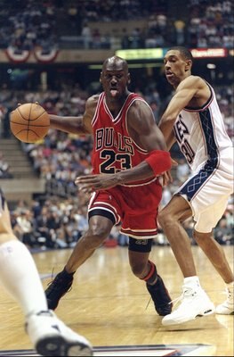 29 Apr 1998: Michael Jordan #23 of the Chicago Bulls in action against Kerry Kittles #30 of the New Jersey Nets during the NBA Playoffs round 3 game at the Continental Airlines Arena in East Rutherford, New Jersey. The Bulls defeated the Nets 116-101.