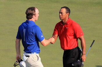 AUGUSTA, GA - APRIL 10:  (L-R) Martin Laird of Scotland and Tiger Woods shake hands on the 18th green during the final round of the 2011 Masters Tournament on April 10, 2011 in Augusta, Georgia.  (Photo by David Cannon/Getty Images)