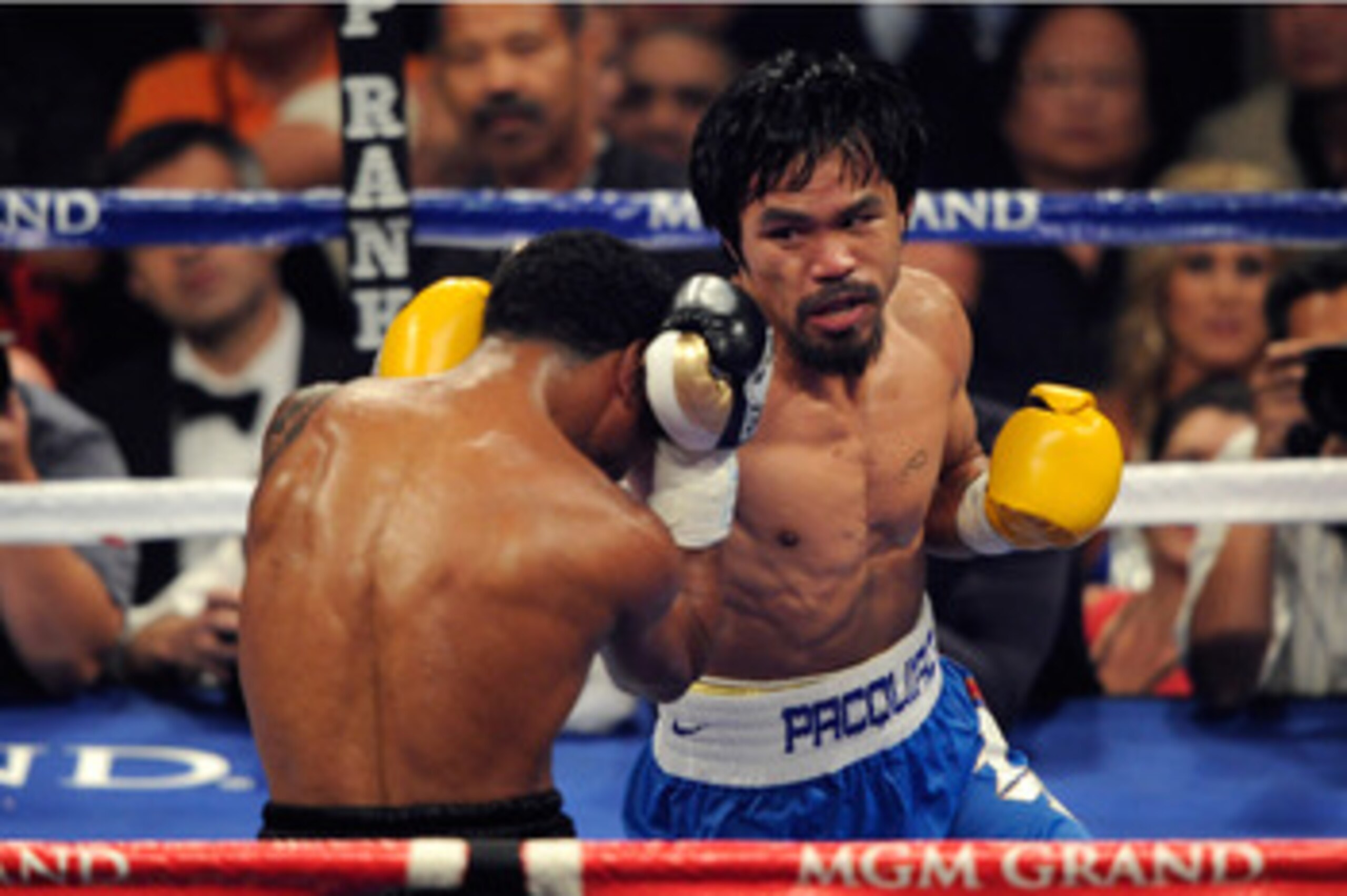 LAS VEGAS, NV - MAY 07:  (R-L) Manny Pacquiao of the Philippines throws a right at Shane Mosley in the WBO welterweight title fight at MGM Grand Garden Arena on May 7, 2011 in Las Vegas, Nevada.  (Photo by Ethan Miller/Getty Images)