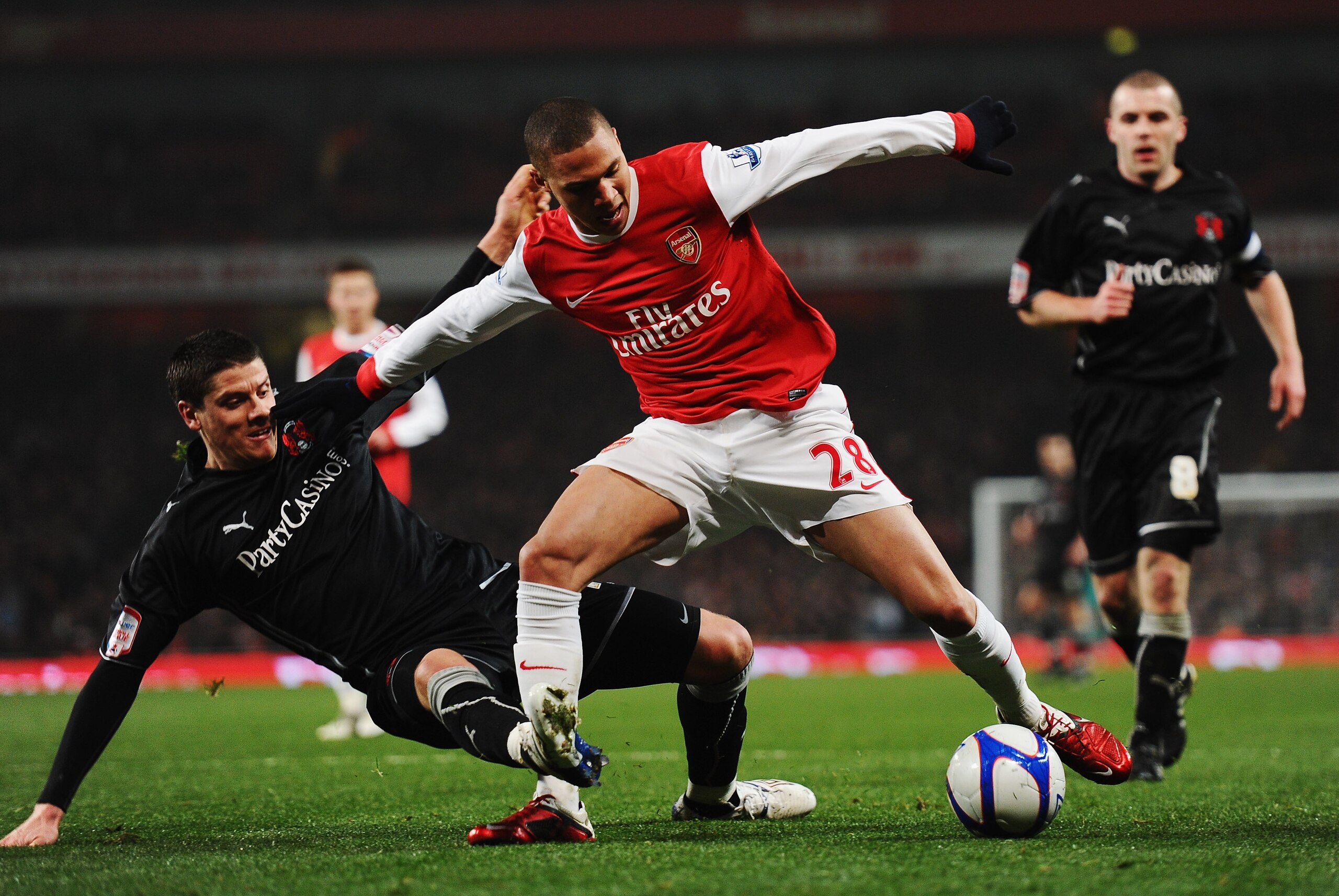 LONDON, UNITED KINGDOM - MARCH 02:  Alex Revell (L) of Leyton Orient tackles Kieran Gibbs (R) of Arsenal and concedes a penalty during the FA Cup sponsored by E.ON 5th Round Replay match between between Arsenal and Leyton Orient at the Emirates Stadium on