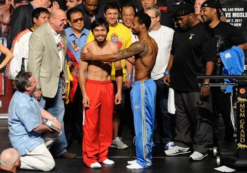 LAS VEGAS, NV - MAY 06:  (L-R) Boxers Manny Pacquiao of the Philippines and Shane Mosley greet each other after the weigh-in for their WBO welterweight title fight at MGM Grand Garden Arena on May 6, 2011 in Las Vegas, Nevada. Pacquiao will defend his WBO