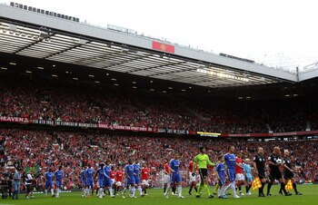 MANCHESTER, ENGLAND - MAY 08:  The Manchester United and Chelsea players walk out prior to the Barclays Premier League match between Manchester United and Chelsea at Old Trafford on May 8, 2011 in Manchester, England.  (Photo by Alex Livesey/Getty Images)