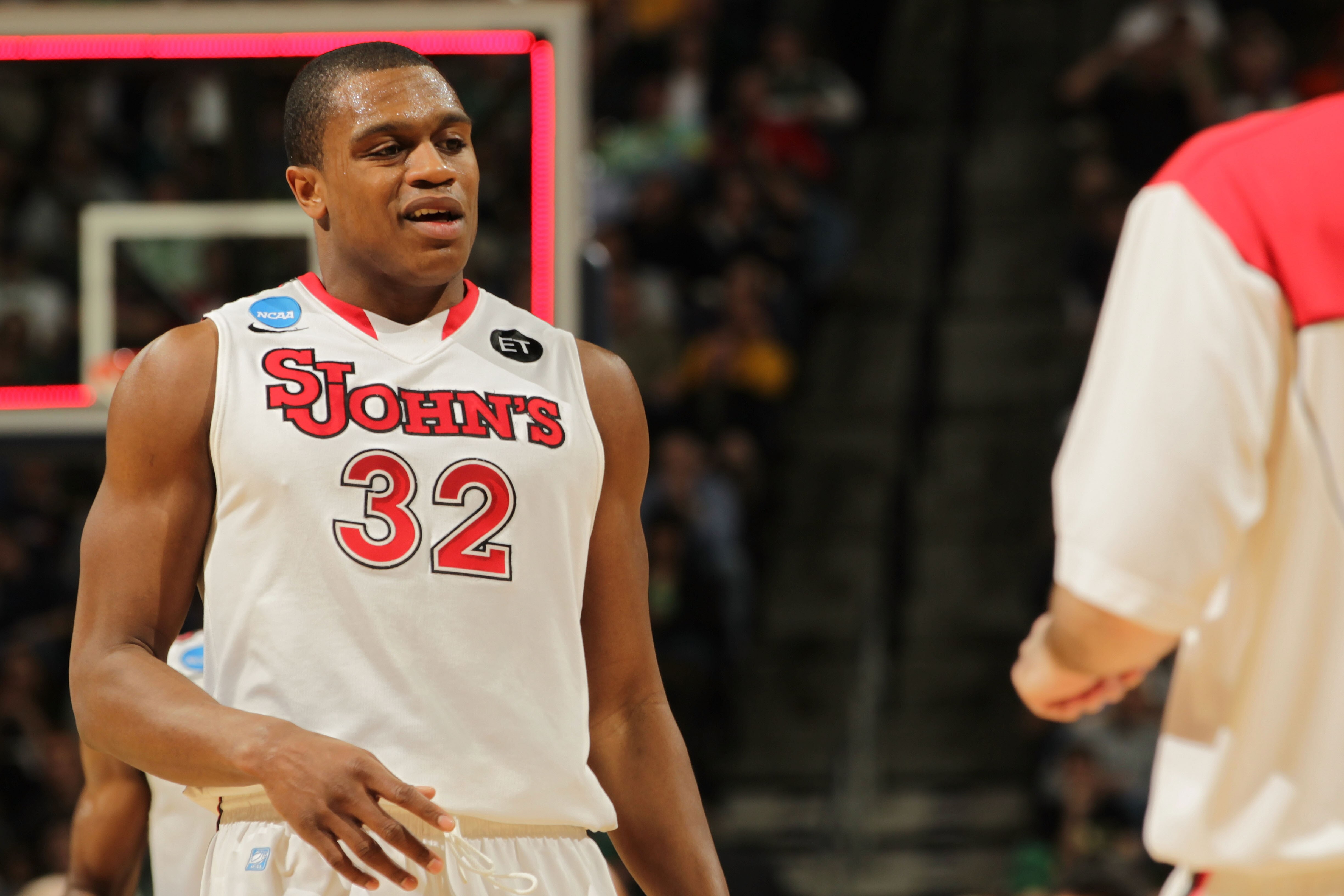 DENVER, CO - MARCH 17:  Justin Brownlee #32 of the St. John's Red Storm looks on against the Gonzaga Bulldogs during the second round of the 2011 NCAA men's basketball tournament at Pepsi Center on March 17, 2011 in Denver, Colorado.  (Photo by Doug Pensi