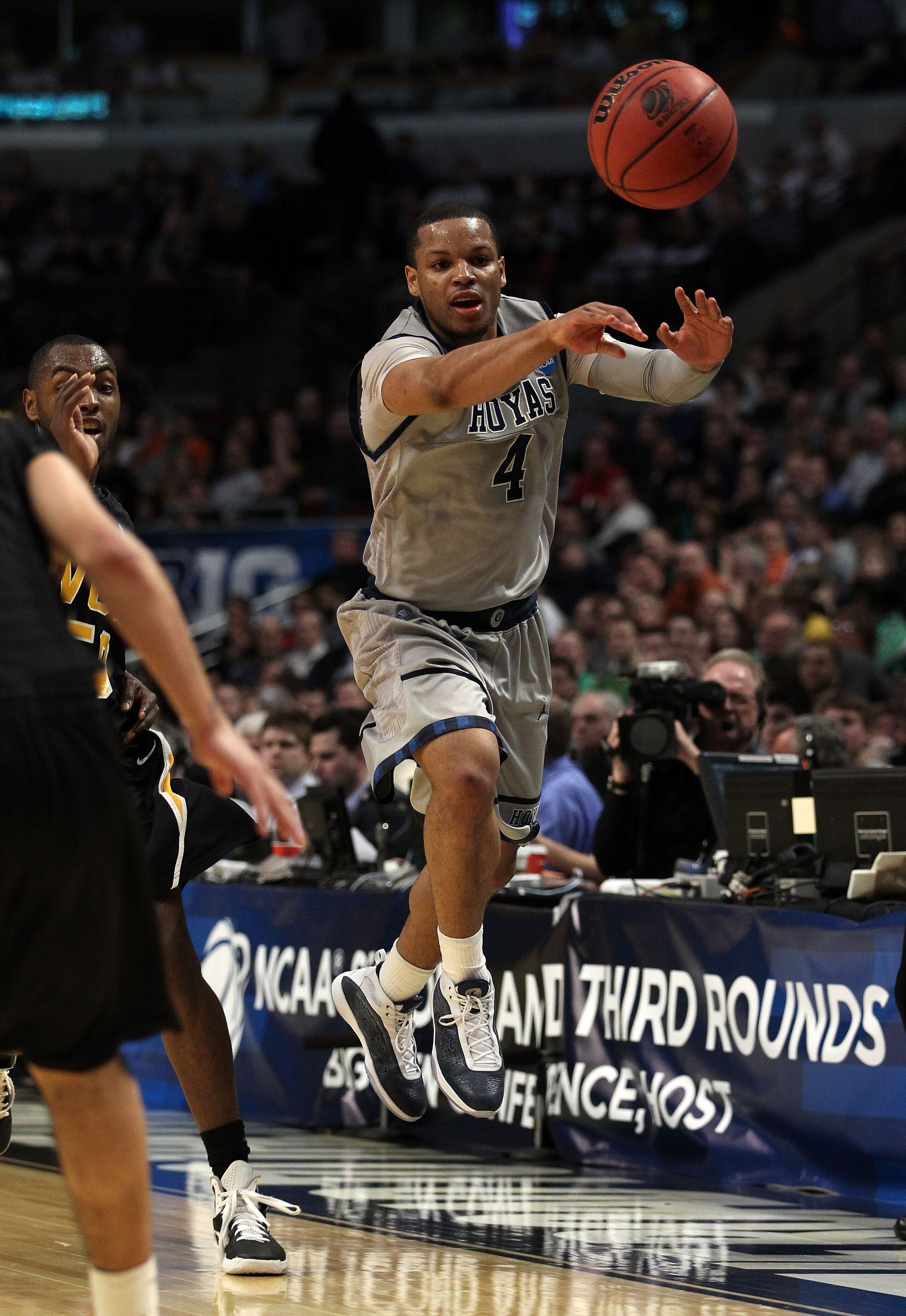 CHICAGO, IL - MARCH 18:  Chris Wright #4 of the Georgetown Hoyas passes against the Virginia Commonwealth Rams in the first half during the second round of the 2011 NCAA men's basketball tournament at the United Center on March 18, 2011 in Chicago, Illino