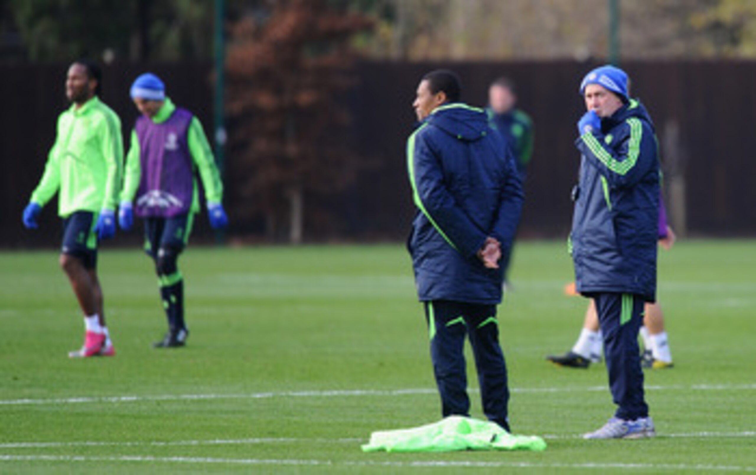COBHAM, ENGLAND - NOVEMBER 22:  Chelsea coach Carlo Ancelotti and assistant coach Michael Emenalo take a Chelsea training session ahead of their UEFA Champions League Group F match against MSK Zilinaon November 22, 2010 in Cobham, England.  (Photo by Mike