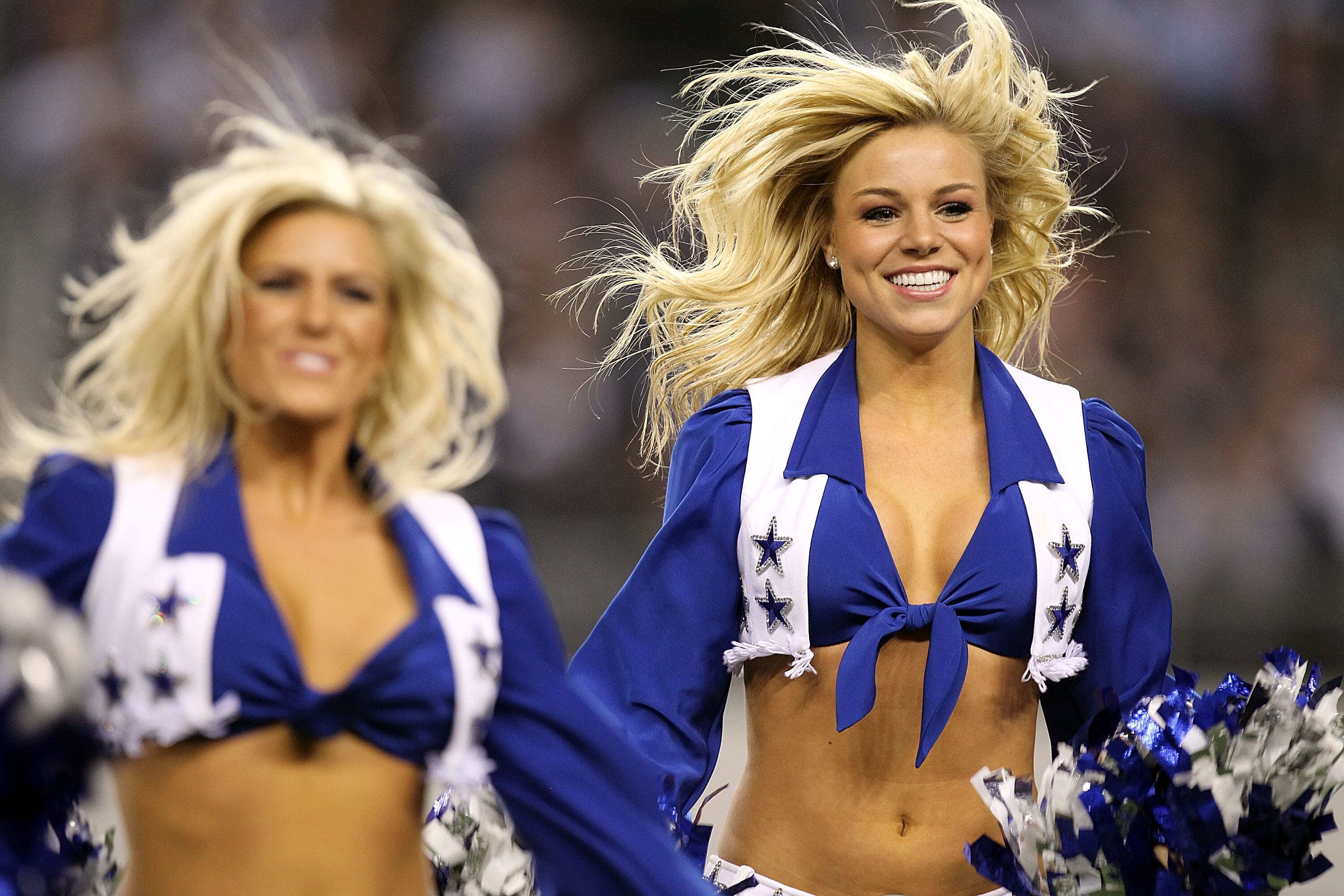 ARLINGTON, TX - DECEMBER 12:  A Dallas Cowboys cheerleader performs at Cowboys Stadium on December 12, 2010 in Arlington, Texas.  (Photo by Ronald Martinez/Getty Images)