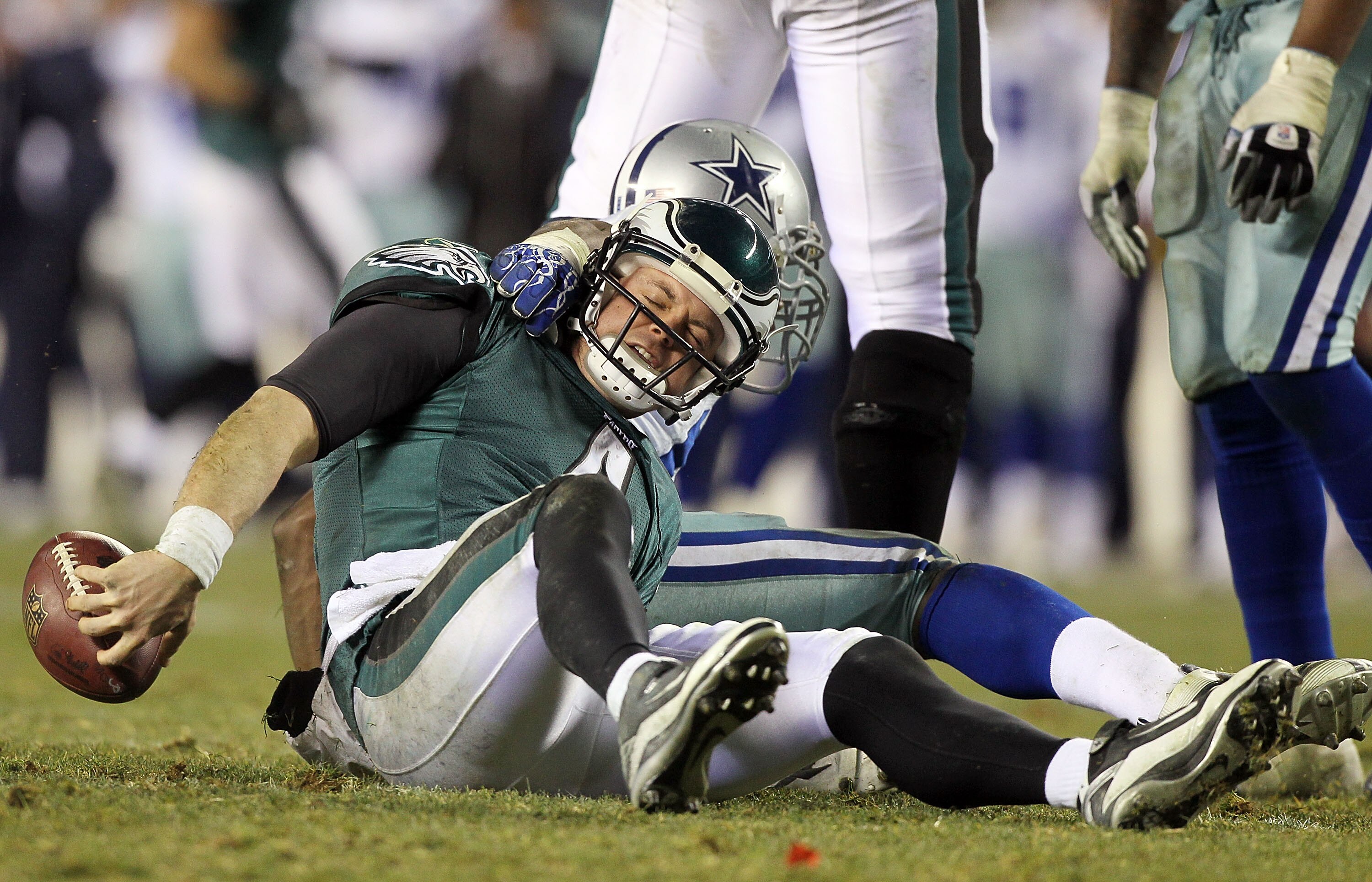 PHILADELPHIA, PA - JANUARY 02:  Kevin Kolb #4 of the Philadelphia Eagles is sacked by DeMarcus Ware #94 of the Dallas Cowboys on January 2, 2011 at Lincoln Financial Field in Philadelphia, Pennsylvania. The Cowboys defeated the Eagles 14-13.  (Photo by Ji