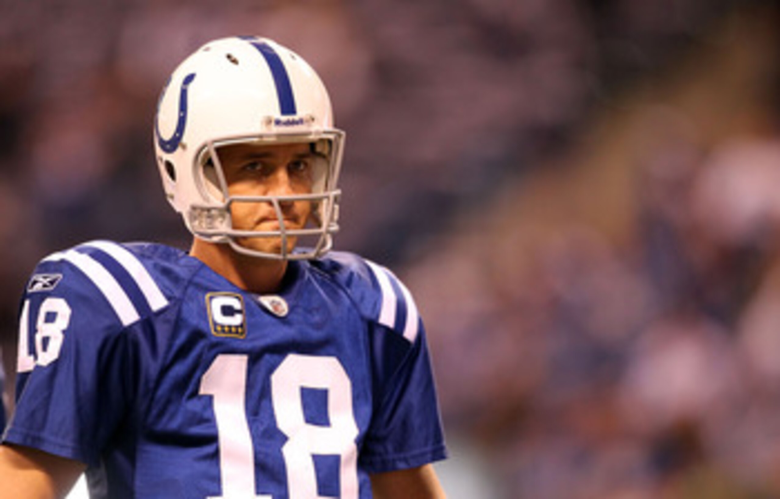 INDIANAPOLIS, IN - JANUARY 08:  Quarterback Peyton Manning #18 of the Indianapolis Colts looks on against the New York Jets during their 2011 AFC wild card playoff game at Lucas Oil Stadium on January 8, 2011 in Indianapolis, Indiana. The Jets won 17-16.