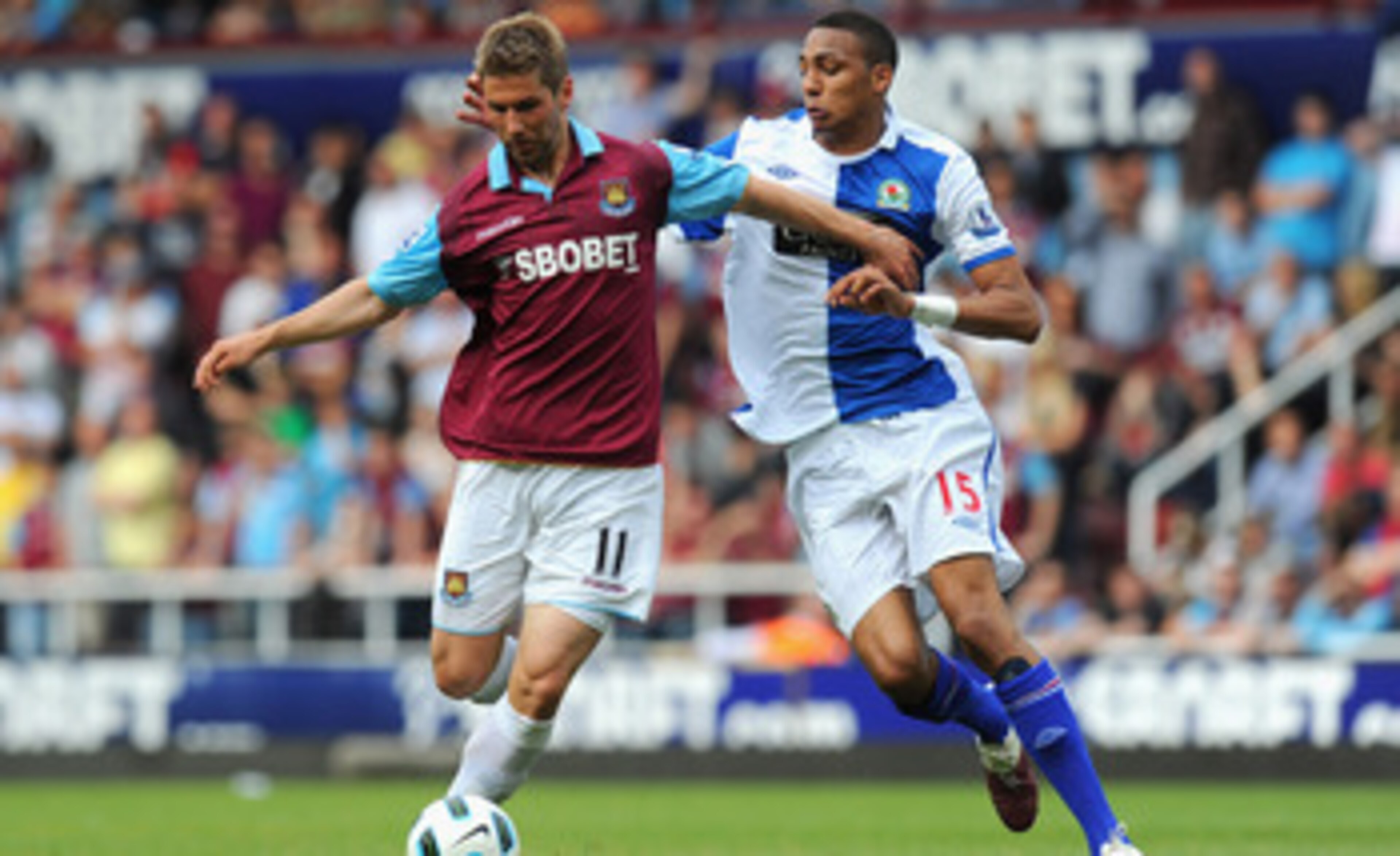 LONDON, ENGLAND - MAY 07:  Thomas Hitzlsperger of West Ham United is closed down by Steven Nzonzi of Blackburn Rovers during the Barclays Premier League match between West Ham United and Blackburn Rovers at the Boleyn Ground on May 7, 2011 in London, Engl