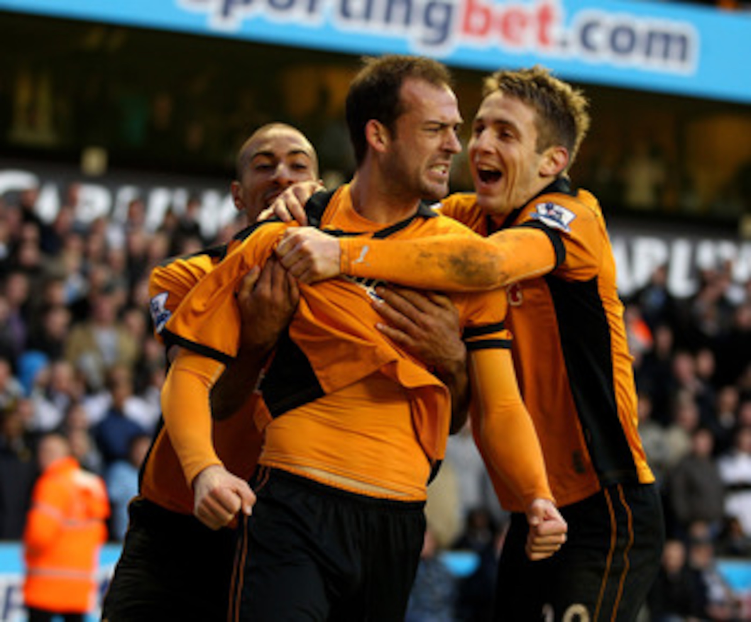 WOLVERHAMPTON, ENGLAND - MARCH 06:  Steven Fletcher (C) of Wolves celebrates scoring the equalising goal with teammates Karl Henry (L) and Kevin Doyle (R) during the Barclays Premier League match between Wolverhampton Wanderers and Tottenham Hotspur at Mo