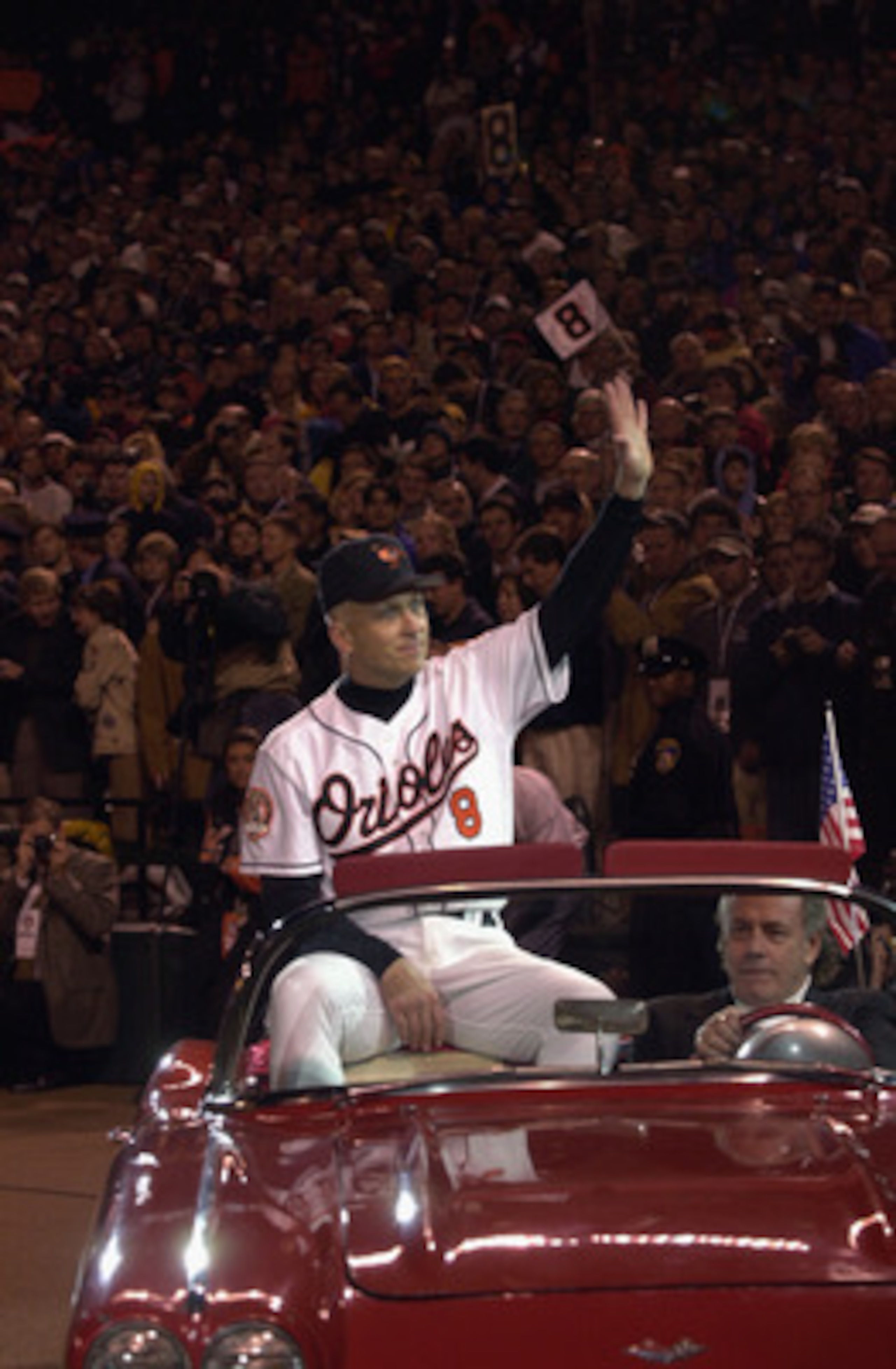 BALTIMORE - OCTOBER 6: Cal Ripken Jr. #8 of the Baltimore Orioles waves to the crowd, while riding in a car, during the October 6, 2001 ceremony to honor Ripken's 3001st and final game of his career. After the ceremony, the Baltimore Orioles would lose t BALTIMORE - OCTOBER 6: Cal Ripken Jr. #8 of the Baltimore Orioles waves to the crowd, while riding in a car, during the October 6, 2001 ceremony to honor Ripken's 3001st and final game of his career. After the ceremony, the Baltimore Orioles would lose t