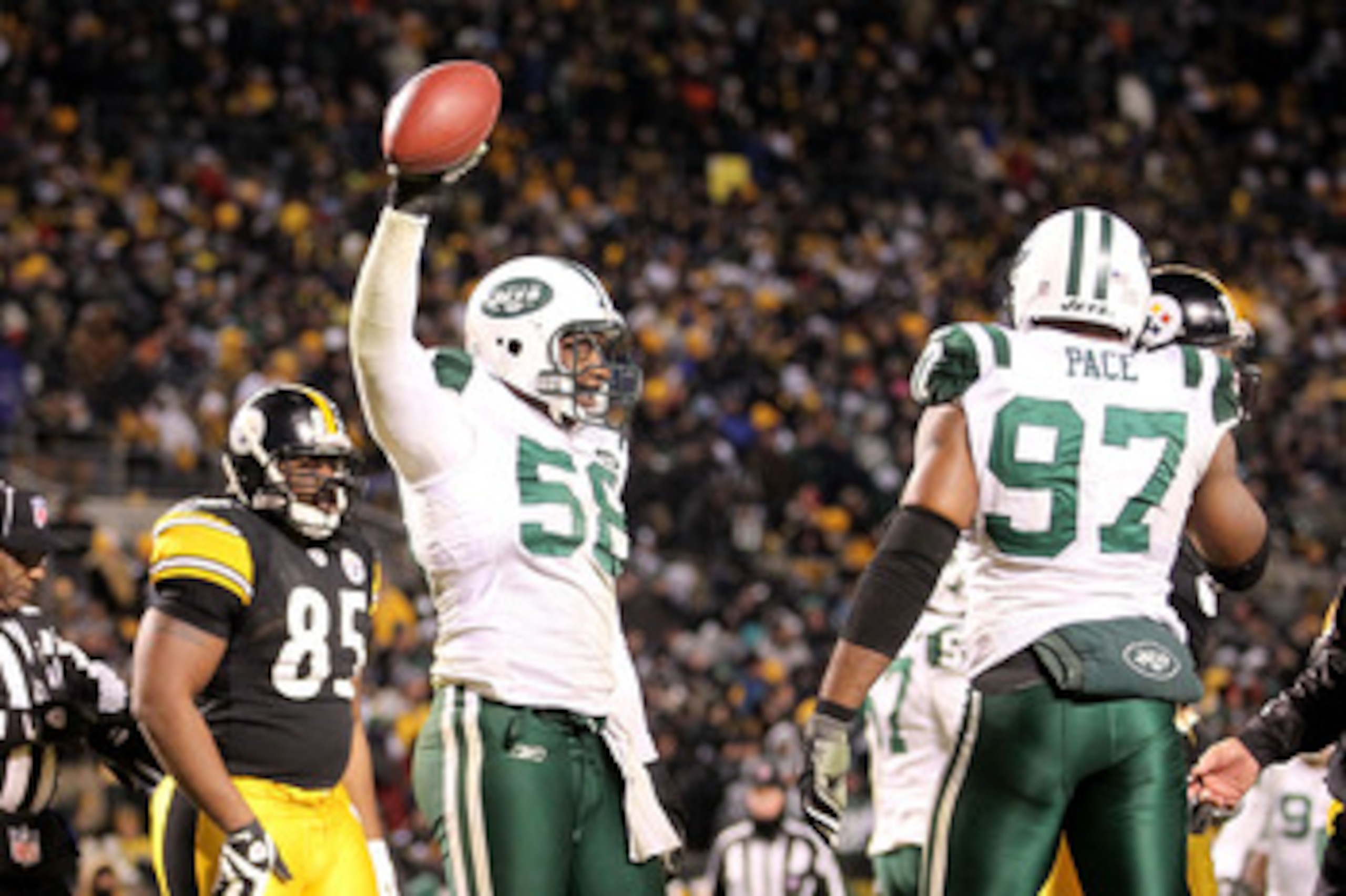 PITTSBURGH, PA - JANUARY 23:  Josh Mauga #58 and Calvin Pace #97 of the New York Jets celebrate after a fourth quarter safety against the Pittsburgh Steelers during the 2011 AFC Championship game at Heinz Field on January 23, 2011 in Pittsburgh, Pennsylva