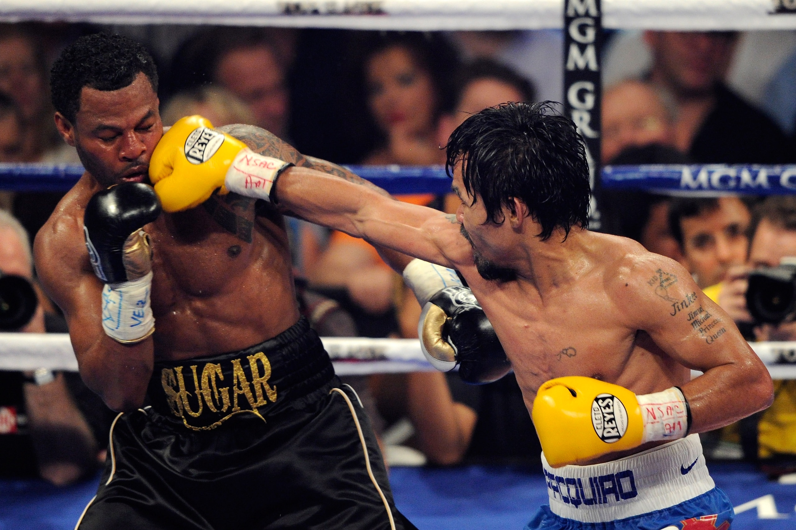 LAS VEGAS, NV - MAY 07:  (R-L) Manny Pacquiao of the Philippines throws a right at Shane Mosley in the WBO welterweight title fight at MGM Grand Garden Arena on May 7, 2011 in Las Vegas, Nevada.  (Photo by Ethan Miller/Getty Images)