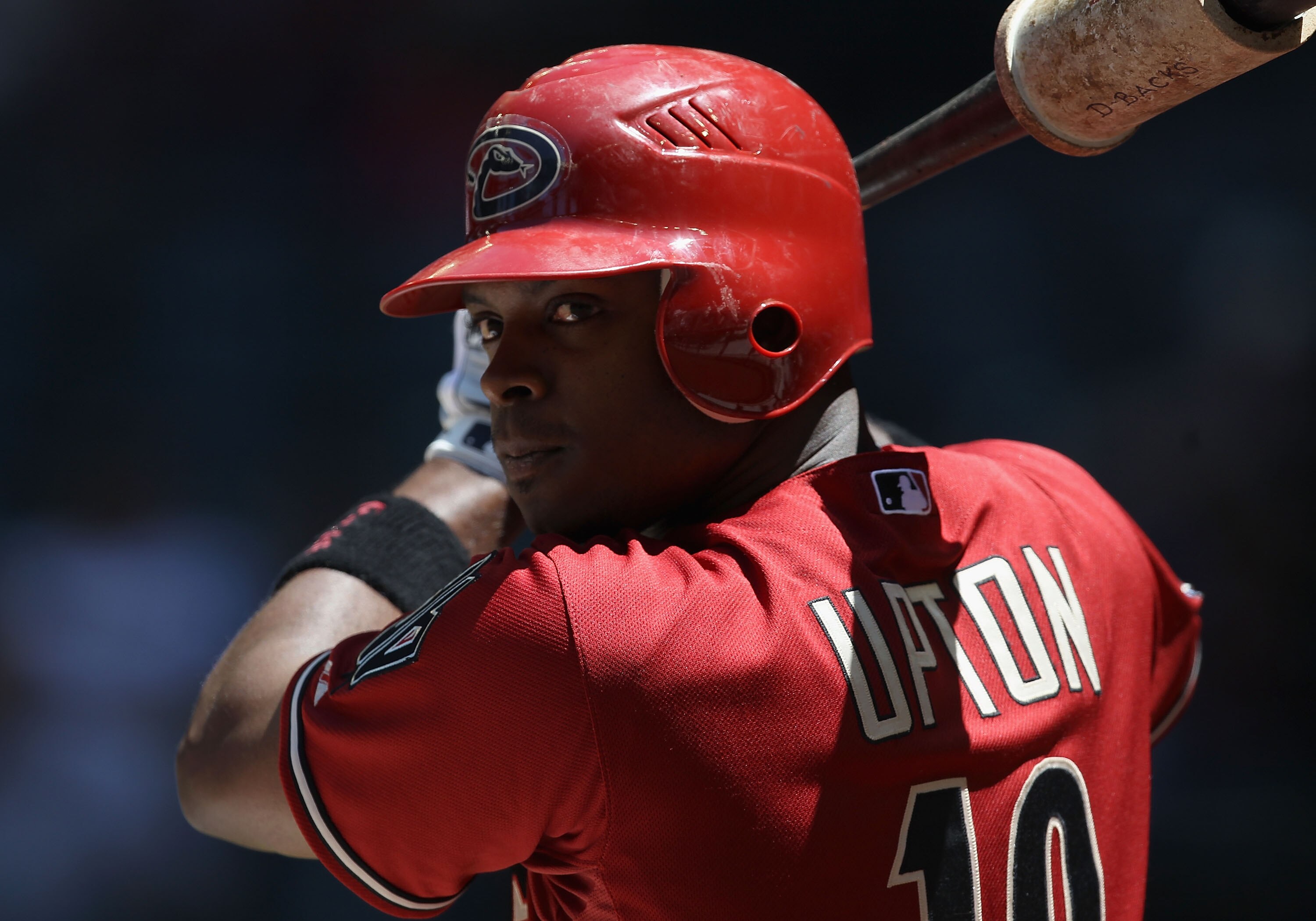 PHOENIX, AZ - MAY 01:  Justin Upton #10 of the Arizona Diamondbacks warms up on deck during the Major League Baseball game against the Chicago Cubs at Chase Field on May 1, 2011 in Phoenix, Arizona. The Diamondbacks defeated the Cubs 4-3.  (Photo by Chris