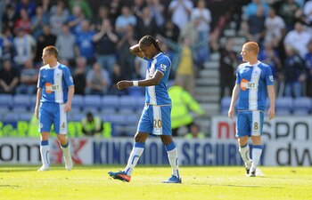 WIGAN, ENGLAND - APRIL 30: Hugo Rodallega of Wigan looks dejected after Everton's first goal during the Barclays Premier League match between Wigan and Everton at the DW Stadium on April 30, 2011 in Wigan, England.  (Photo by Michael Regan/Getty Images)