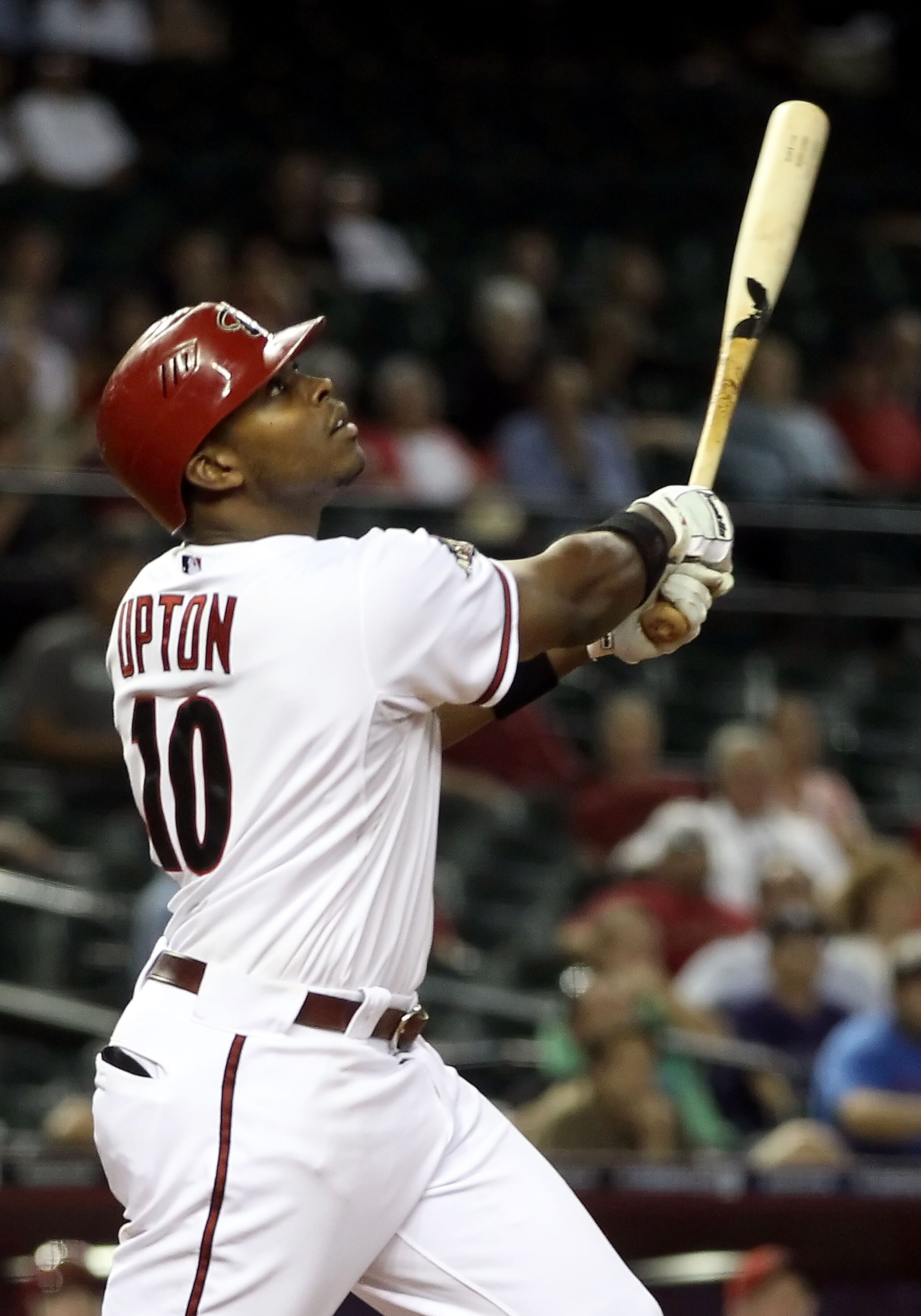 PHOENIX, AZ - MAY 05: Justin Upton #10 of the Arizona Diamondbacks hits the game winning RBI single against the Colorado Rockies during the 11th inning of the Major League Baseball game at Chase Field on May 5, 2011 in Phoenix, Arizona.  The Diamondbacks