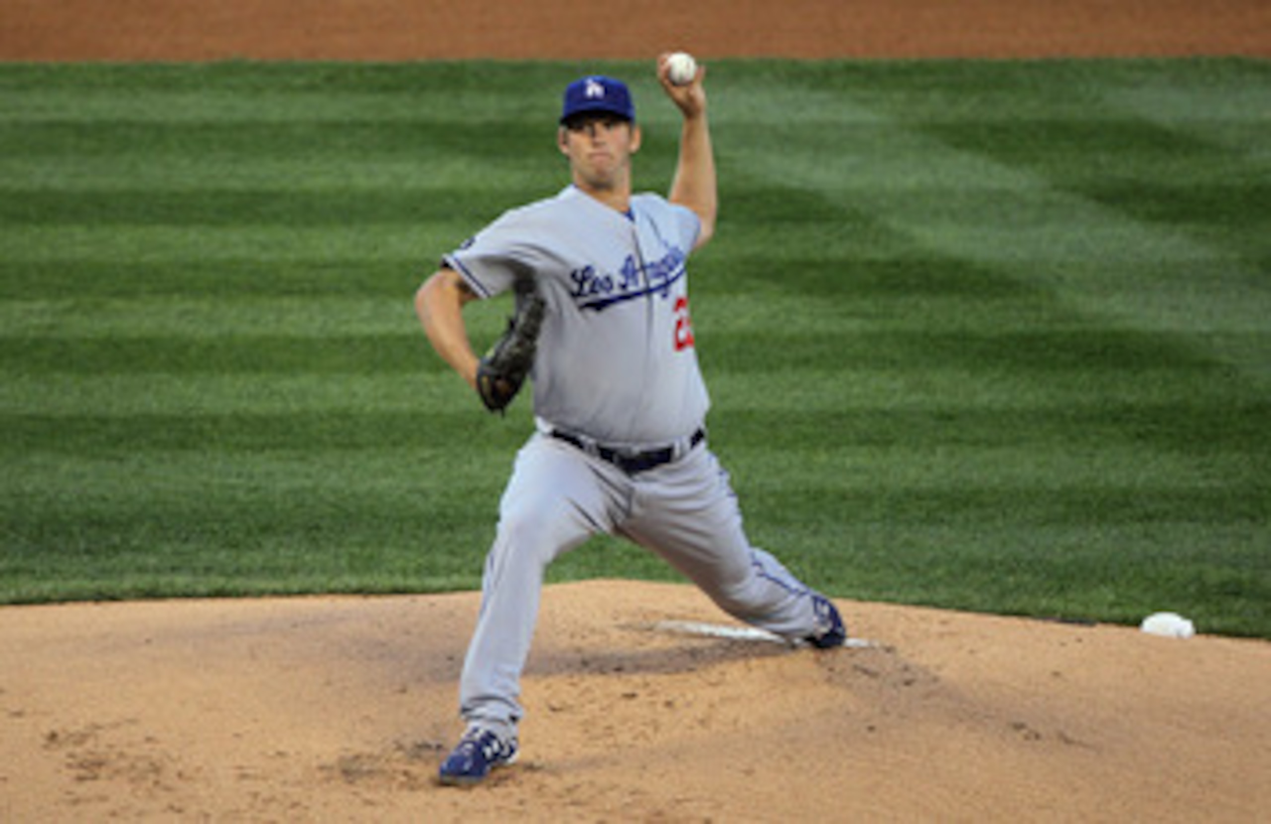 DENVER, CO - APRIL 05: Starting pitcher Clayton Kershaw #22 of the Los Angeles Dodgers delivers against the Colorado Rockies at Coors Field on April 5, 2011 in Denver, Colorado. Kershaw collected the loss as the Rockies defeated the Dodgers 3-0. (Photo DENVER, CO - APRIL 05: Starting pitcher Clayton Kershaw #22 of the Los Angeles Dodgers delivers against the Colorado Rockies at Coors Field on April 5, 2011 in Denver, Colorado. Kershaw collected the loss as the Rockies defeated the Dodgers 3-0. (Photo