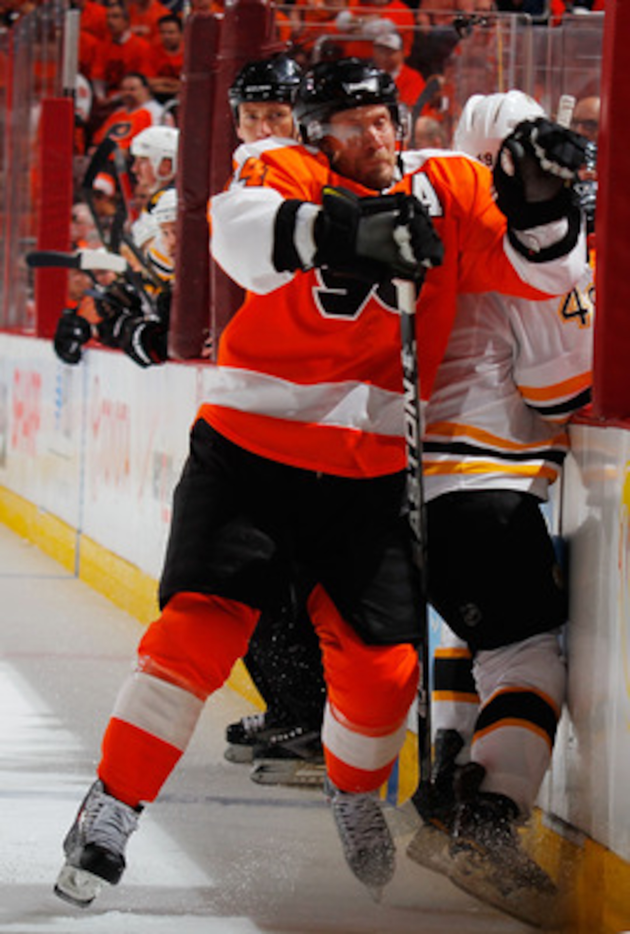 PHILADELPHIA, PA - MAY 02:  Rich Peverly #49 of the Boston Bruins is checked by Kimmo Timonen #44 of the Philadelphia Flyers during the second period of Game Two of the Eastern Conference Semifinals during the 2011 NHL Stanley Cup Playoffs at Wells Fargo