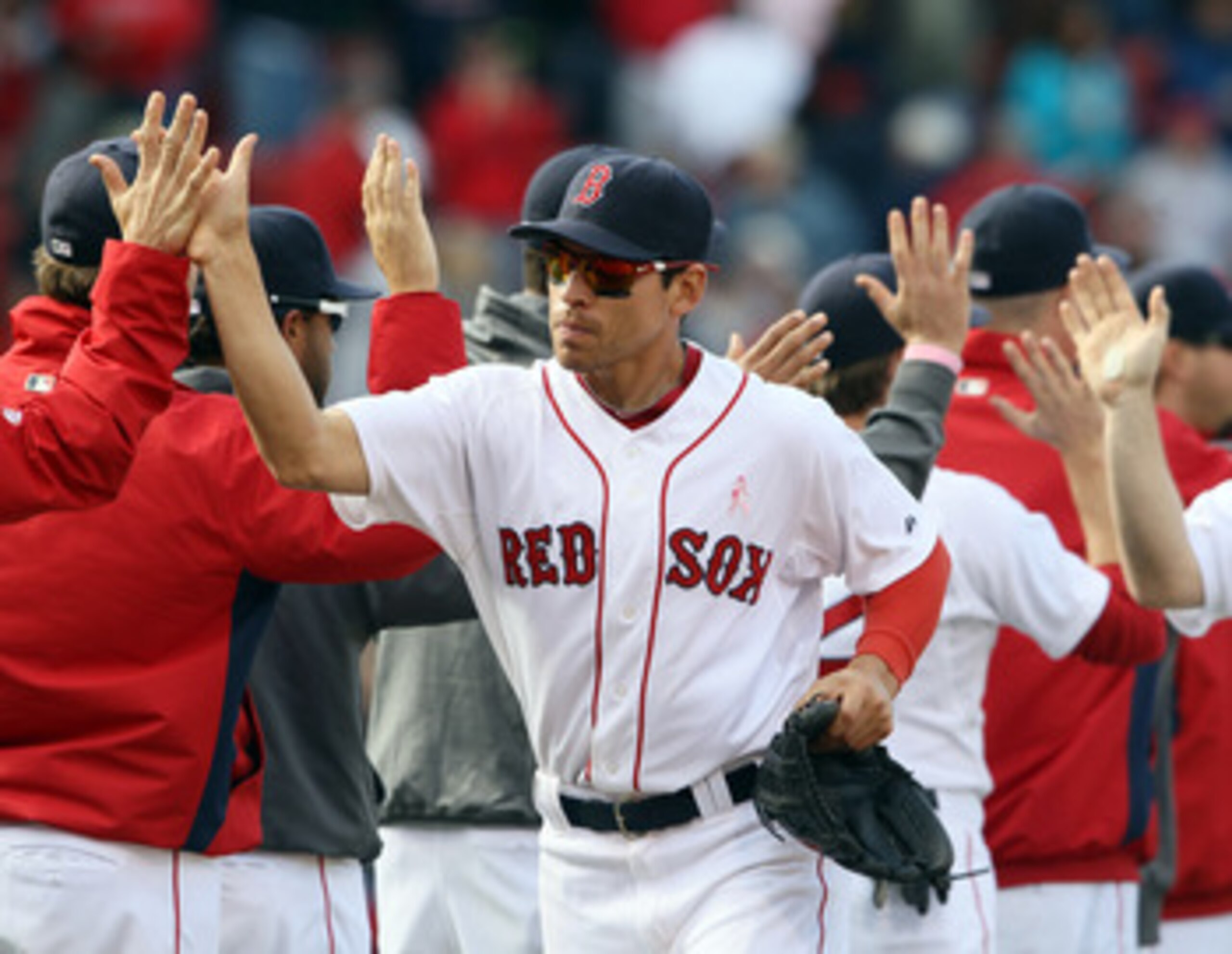 BOSTON, MA - MAY 08: Jacoby Ellsbury #2 of the Boston Red Sox celebrates the win with teammates after the game against the Minnesota Twins on May 8, 2011 at Fenway Park in Boston, Massachusetts. The Boston Red Sox defeated the Minnesota Twins 9-5. (Phot BOSTON, MA - MAY 08: Jacoby Ellsbury #2 of the Boston Red Sox celebrates the win with teammates after the game against the Minnesota Twins on May 8, 2011 at Fenway Park in Boston, Massachusetts. The Boston Red Sox defeated the Minnesota Twins 9-5. (Phot