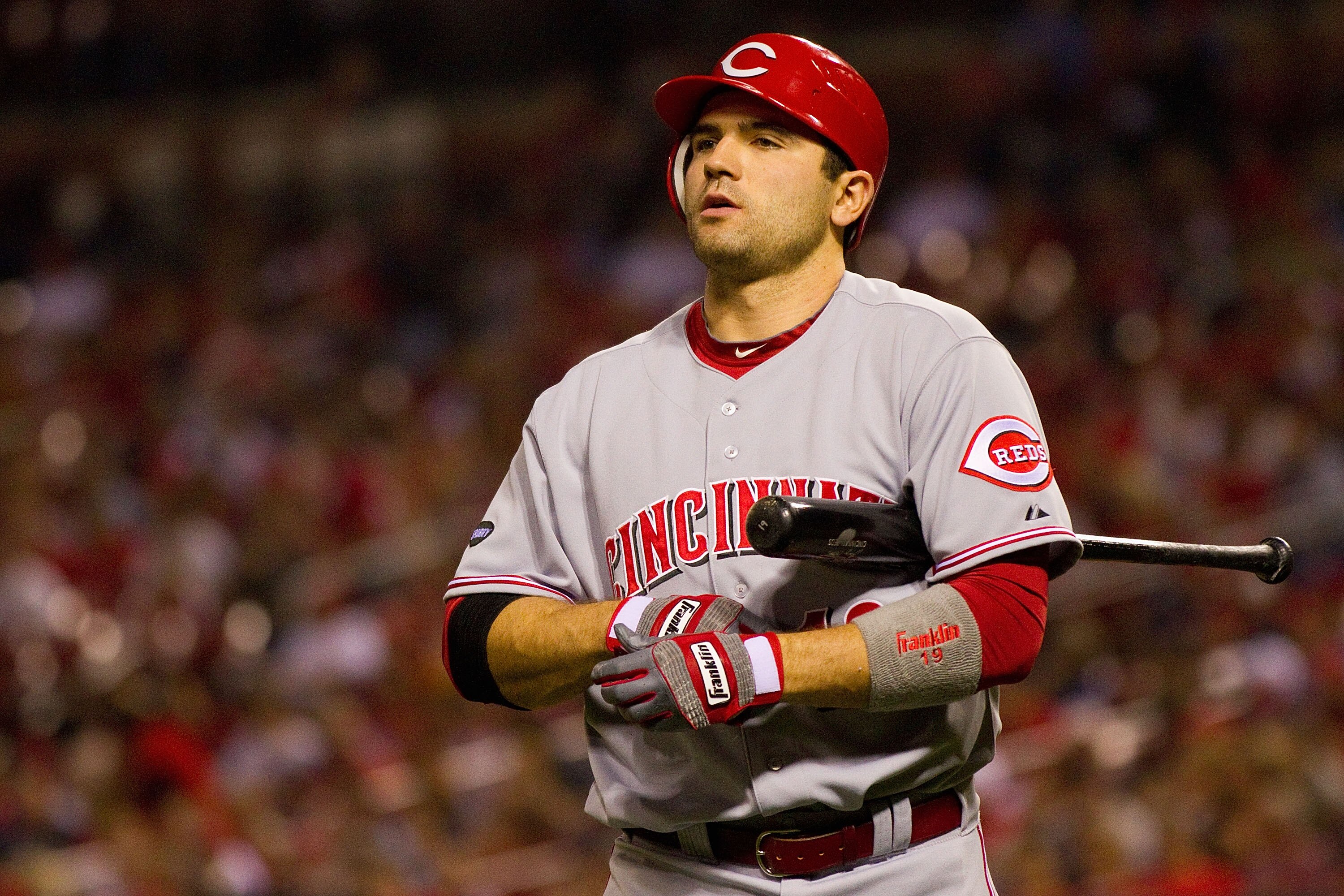 ST. LOUIS, MO - APRIL 22: Joey Votto #19 of the Cincinnati Reds returns to the dugout after striking out against the St. Louis Cardinals at Busch Stadium on April 22, 2011 in St. Louis, Missouri.  (Photo by Dilip Vishwanat/Getty Images)