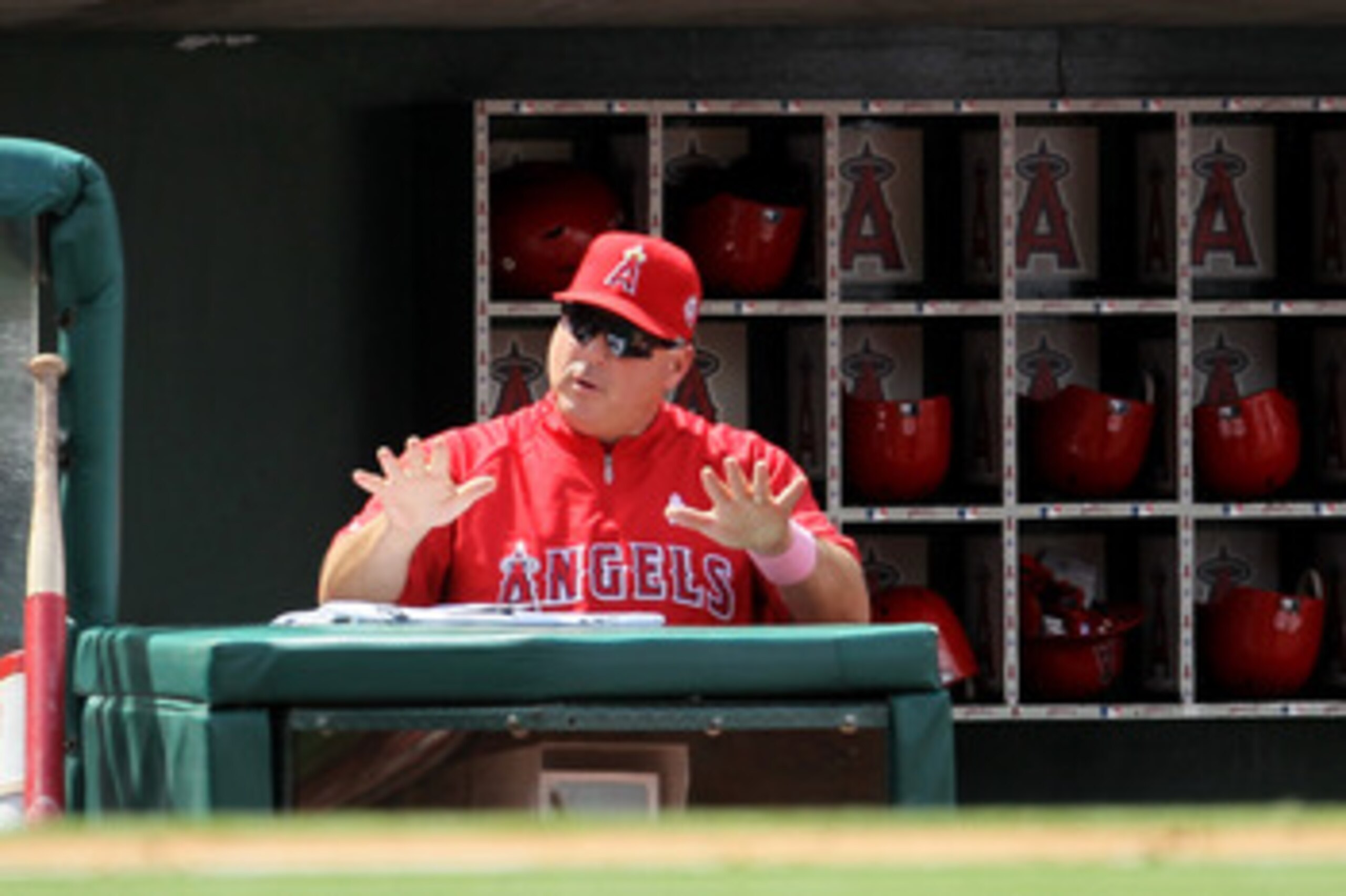 ANAHEIM, CA - MAY 08:  Manager Mike Scioscia of the Los Angeles Angels of Anaheim signals during the game against the Cleveland Indians on May 8, 2011 at Angel Stadium in Anaheim, California.  The win was Scoiscia's 1,000th  career victory as a manager as