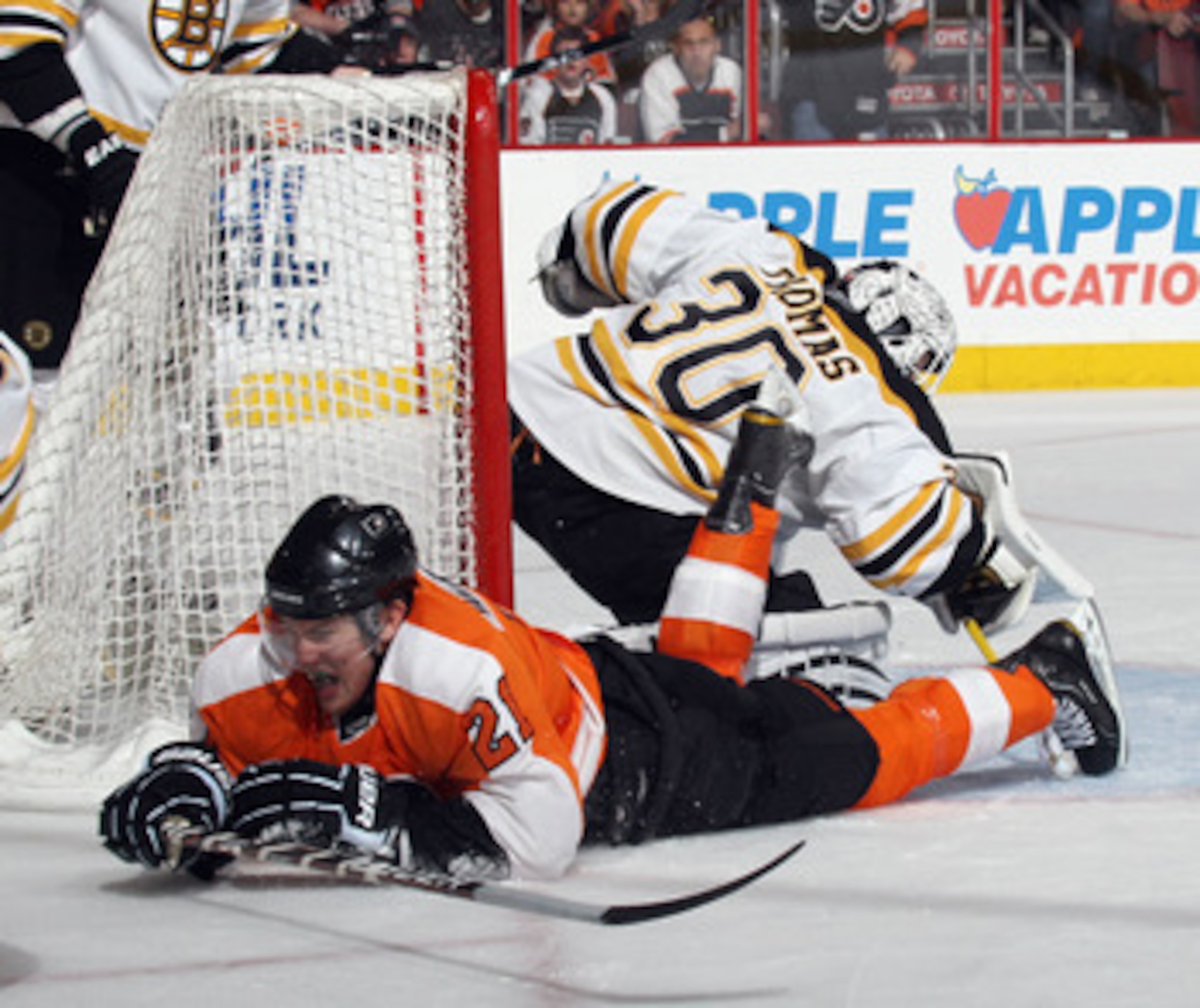 PHILADELPHIA, PA - APRIL 30:  Tim Thomas #30 of the Boston Bruins makes the save on James van Riemsdyk #21 of the Philadelphia Flyers in Game One of the Eastern Conference Semifinals during the 2011 NHL Stanley Cup Playoffs at the Wells Fargo Center on Ap