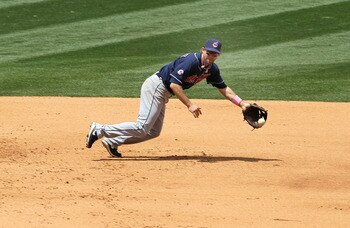 ANAHEIM, CA - MAY 08:  Third baseman Adam Everett #8 of the Cleveland Indians can't reach a single hit by Mark Trumbo #44 of the Los Angeles Angels of Anaheim on May 8, 2011 at Angel Stadium in Anaheim, California.  (Photo by Stephen Dunn/Getty Images)