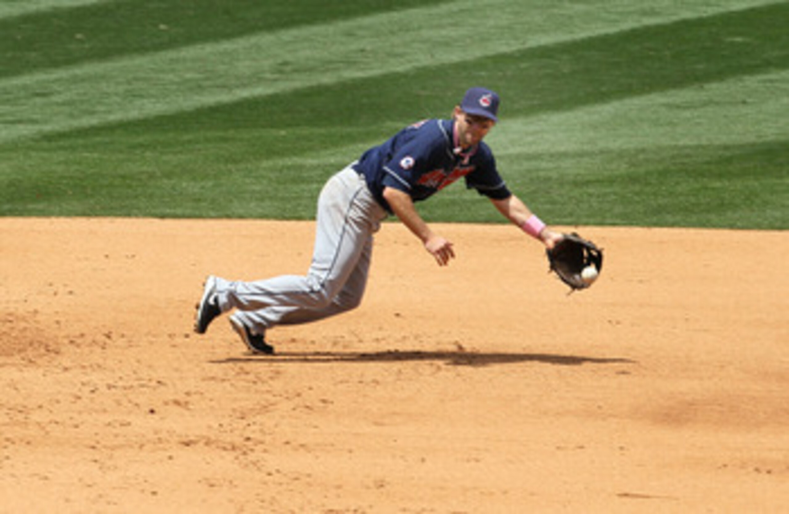 ANAHEIM, CA - MAY 08:  Third baseman Adam Everett #8 of the Cleveland Indians can't reach a single hit by Mark Trumbo #44 of the Los Angeles Angels of Anaheim on May 8, 2011 at Angel Stadium in Anaheim, California.  (Photo by Stephen Dunn/Getty Images)