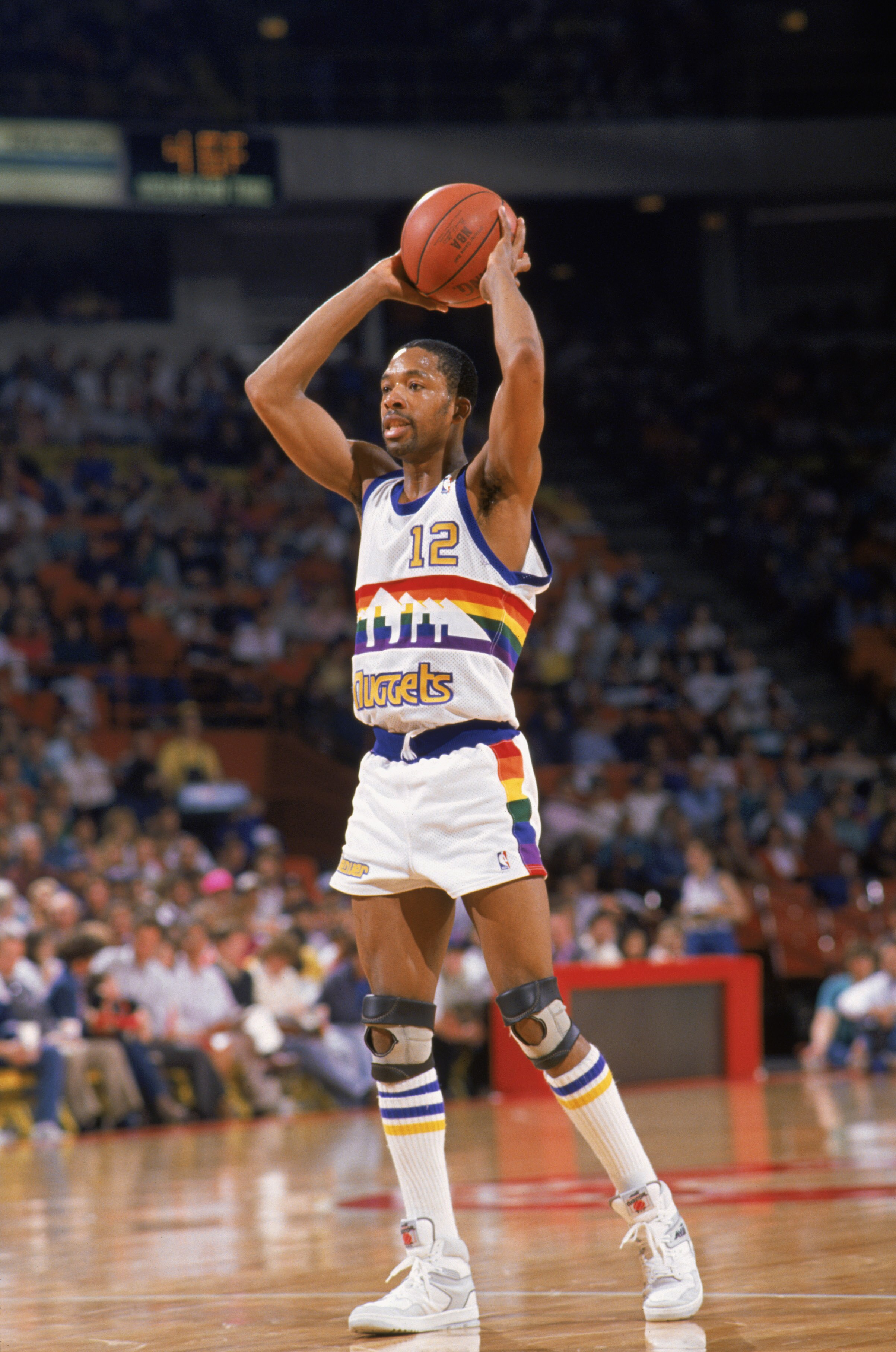 DENVER, CO- 1988:  Fat Lever #12 of the Denver Nuggets looks to pass the ball during a game in the 1988 -1989 NBA Season. NOTE TO USER: User expressly acknowledges and agrees that, by downloading and/or using this Photograph, User is consenting to the ter