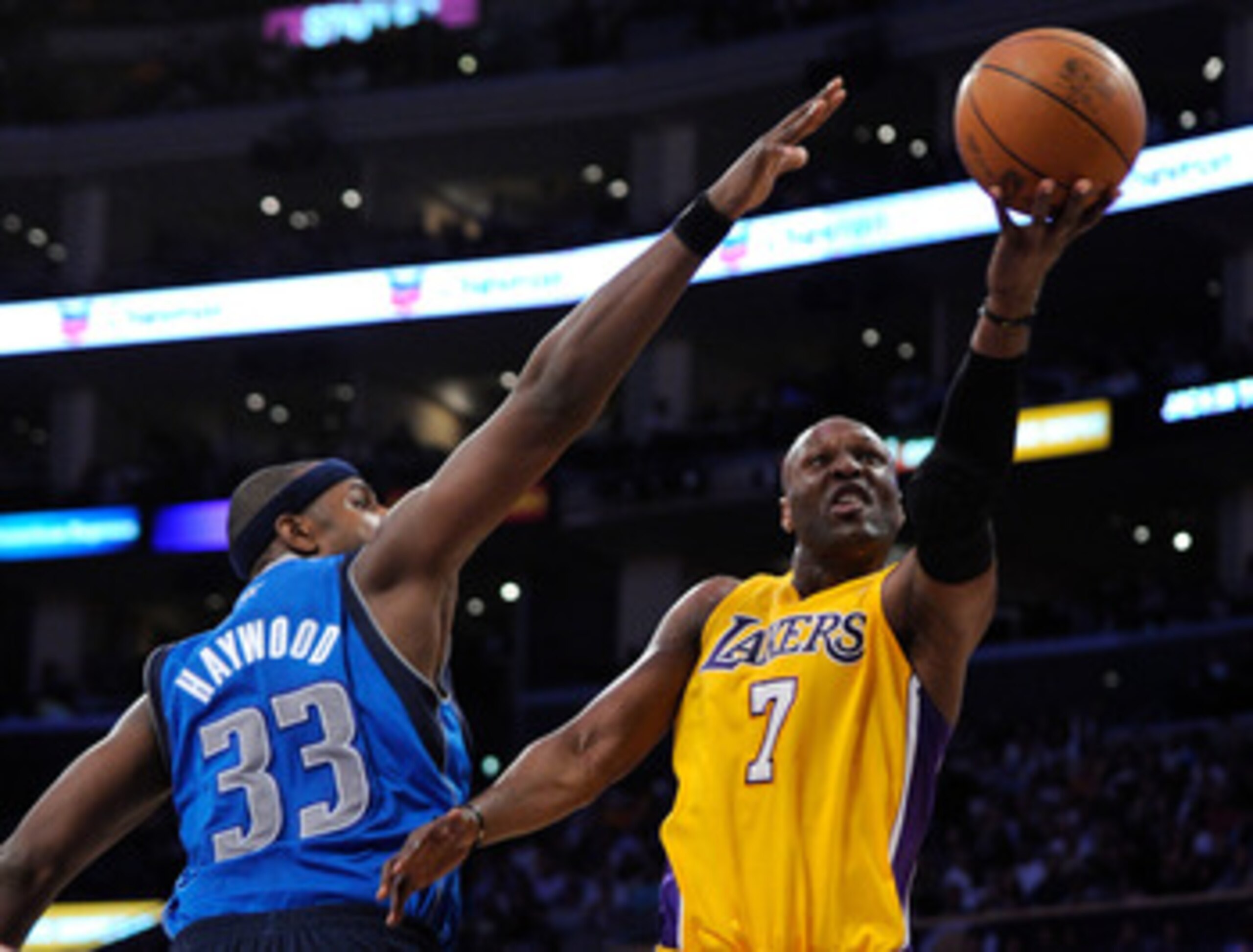 LOS ANGELES, CA - MAY 04:  Lamar Odom #7 of the Los Angeles Lakers goes up for a shot against Brendan Haywood #33 of the Dallas Mavericks in the second half in Game Two of the Western Conference Semifinals in the 2011 NBA Playoffs at Staples Center on May