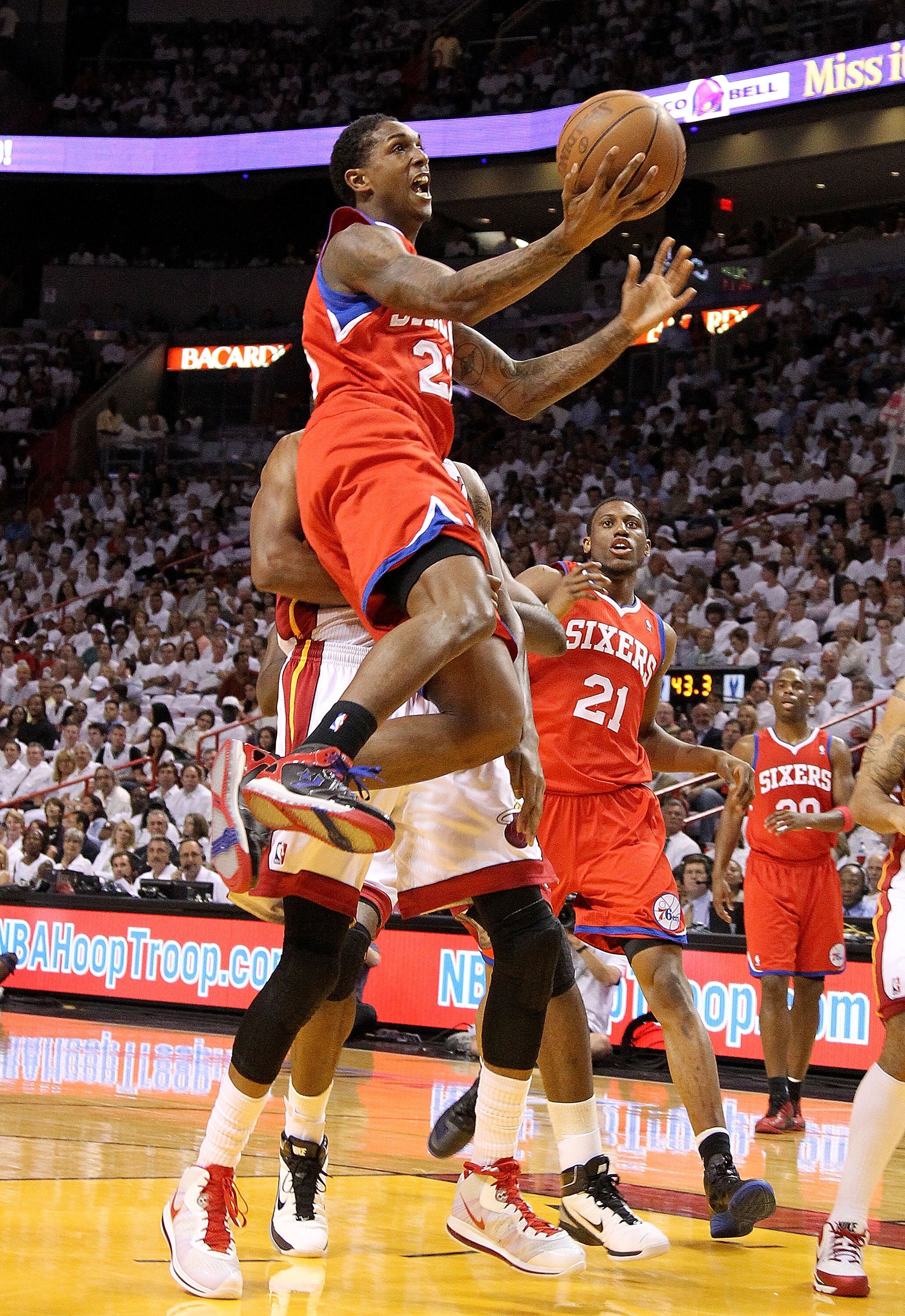 MIAMI, FL - APRIL 27:  Louis Williams #23 of the Philadelphia 76ers drives to the rim past LeBron James #6 of the Miami Heat  during game five of the Eastern Conference Quarterfinals in the 2011 NBA Playoffs at American Airlines Arena on April 27, 2011 in