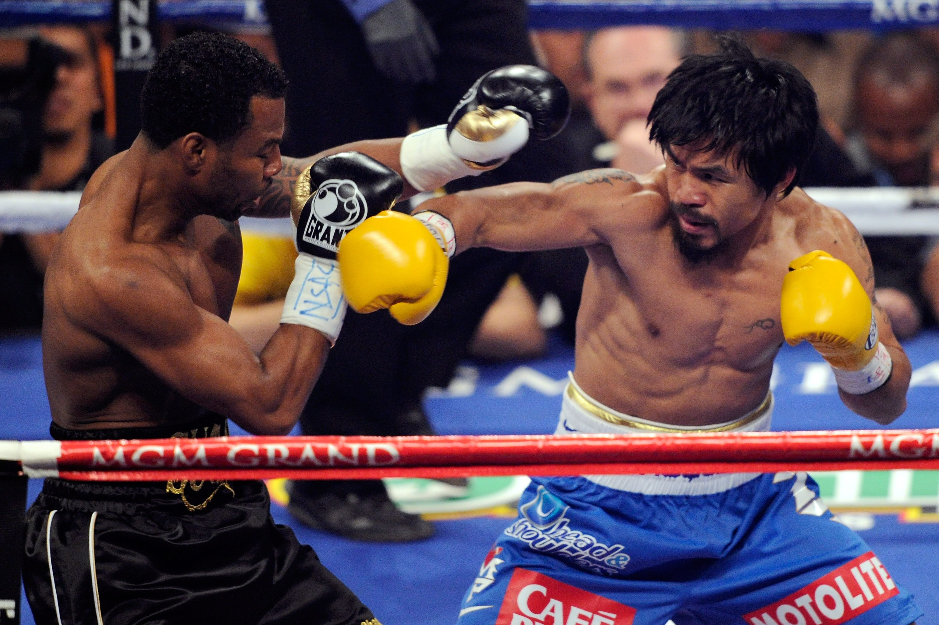 LAS VEGAS, NV - MAY 07:  (R-L) Manny Pacquiao of the Philippines throws a right at Shane Mosley in the WBO welterweight title fight at MGM Grand Garden Arena on May 7, 2011 in Las Vegas, Nevada.  (Photo by Ethan Miller/Getty Images)