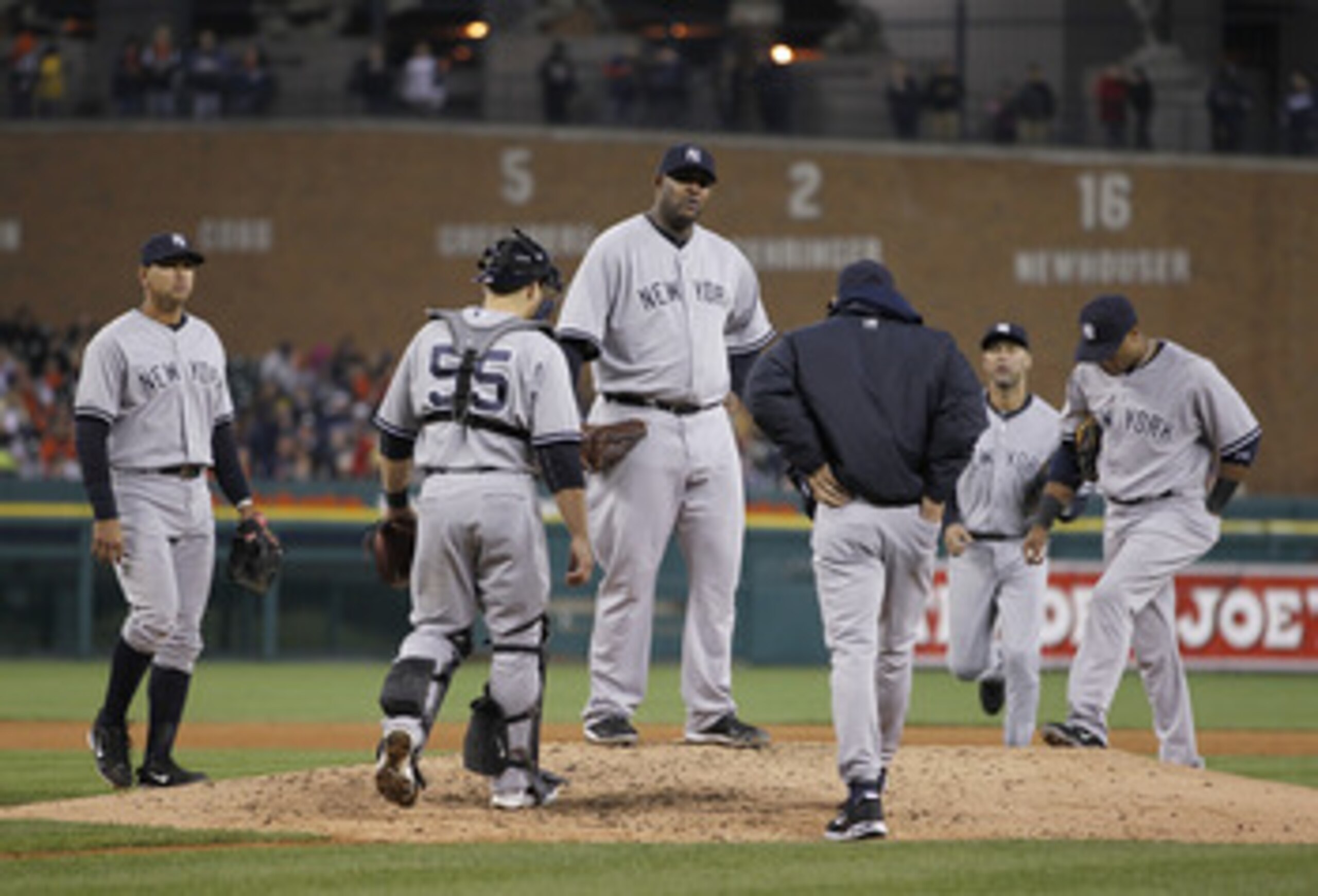 DETROIT, MI - MAY 03: CC Sabathia #52 of the New York Yankees waits for manager Joe Girardi and his teammates on the mound while playing the Detroit Tigers at Comerica Park on May 3, 2011 in Detroit, Michigan. Detroit won the game 4-2. (Photo by Gregory S