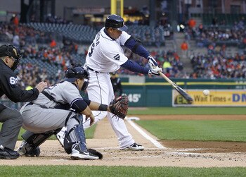 DETROIT, MI - MAY 03: Miguel Cabrera #24 of the Detroit Tigers hits a sacrifice fly to score Scott Sizemore #20 in the first inning in front of Russell Martin #55 of the New York Yankees at Comerica Park on May 3, 2011 in Detroit, Michigan. Detroit won th