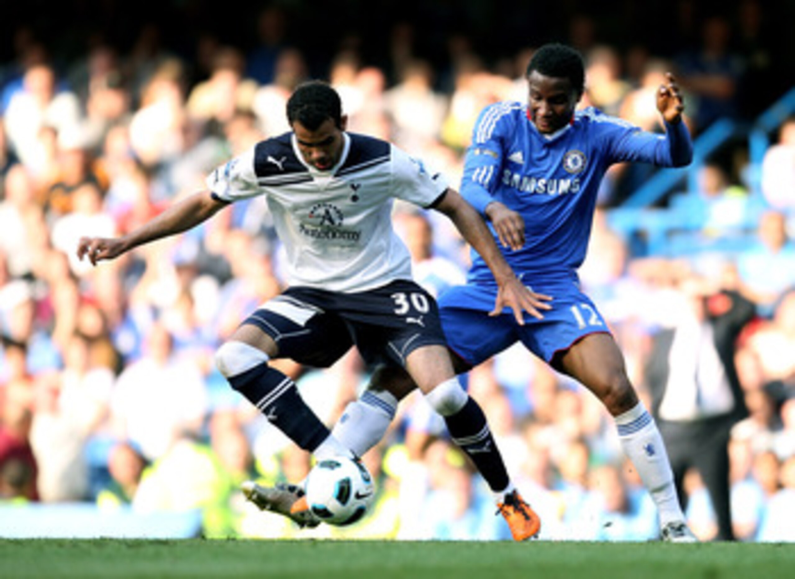 LONDON, ENGLAND - APRIL 30:  Sandro of Spurs and John Obi Mikel of Chelsea compete for the ball during the Barclays Premier League match between Chelsea and Tottenham Hotspur at Stamford Bridge on April 30, 2011 in London, England.  (Photo by Scott Heavey