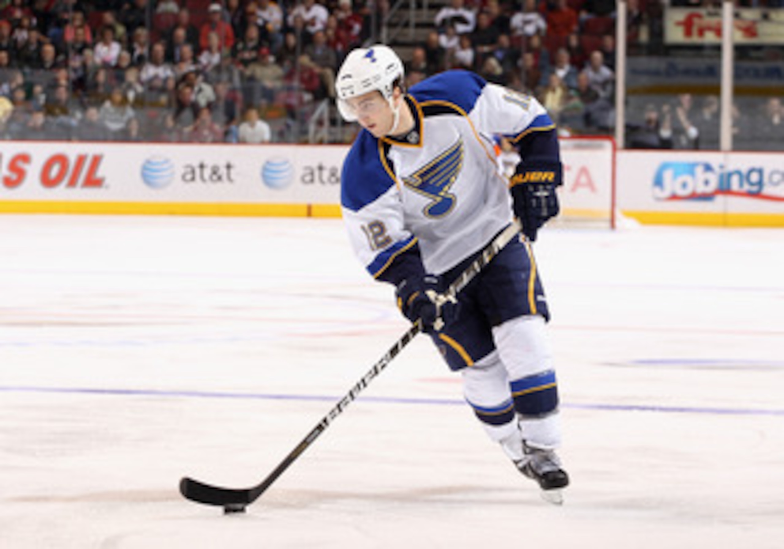 GLENDALE, AZ - MARCH 22:  Kevin Shattenkirk #12 of the St. Louis Blues skates with the puck during the NHL game against the Phoenix Coyotes at Jobing.com Arena on March 22, 2011 in Glendale, Arizona.  The Coyotes defeated the Blues 2-1.  (Photo by Christi