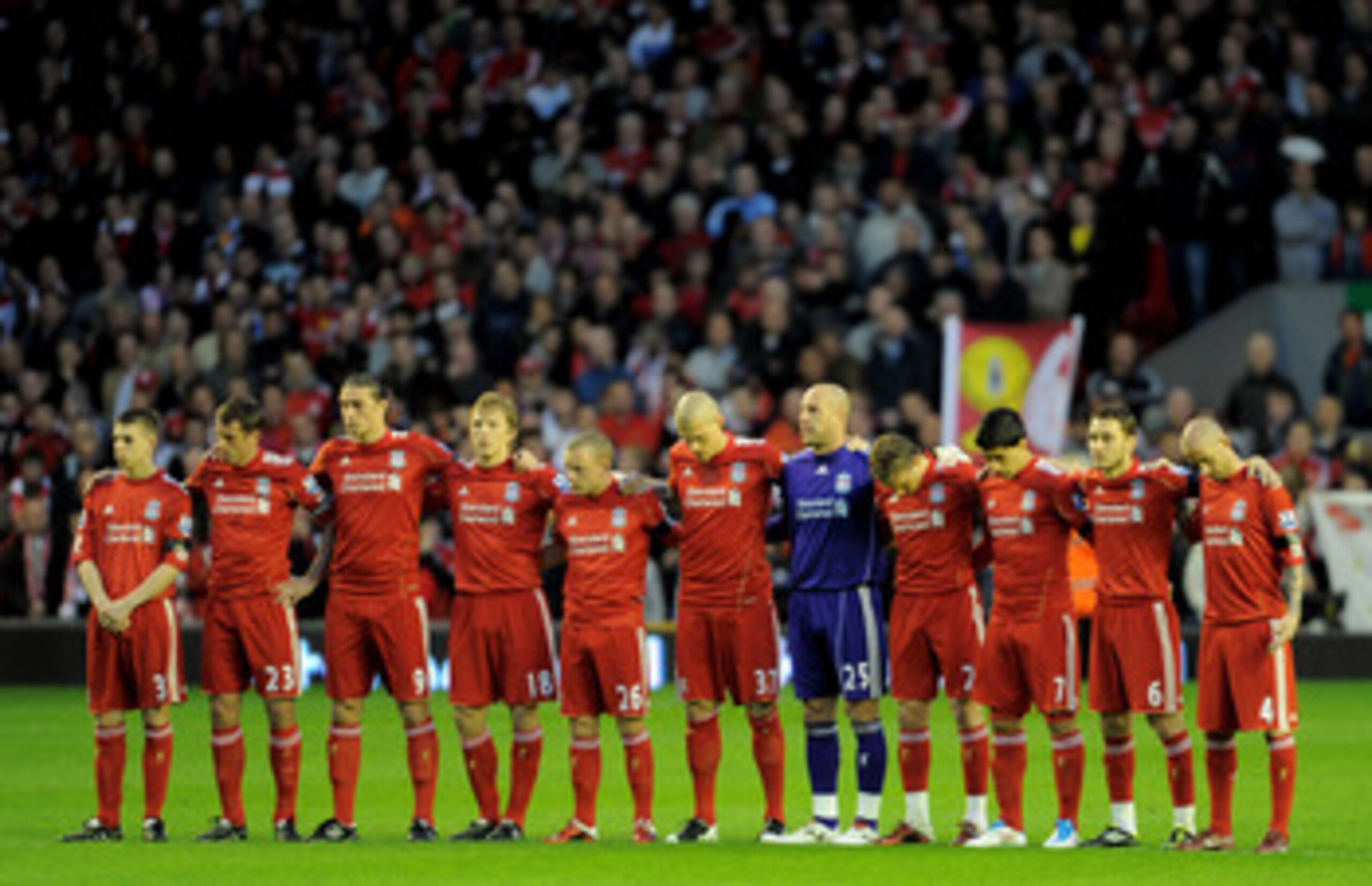 LIVERPOOL, ENGLAND - APRIL 11:  The Liverpool  players acknowledge a minutes silence in memory of the victims of the Hillsborough disaster prior to the Barclays Premier League match between Liverpool and Manchester City at Anfield on April 11, 2011 in Liv