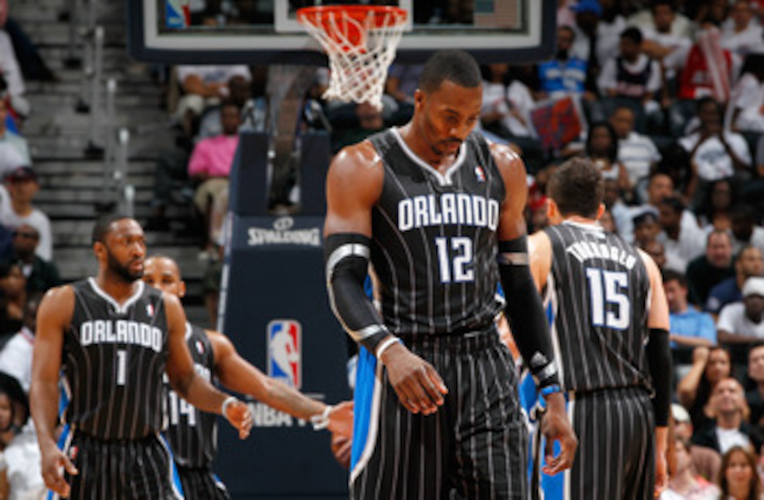 ATLANTA, GA - APRIL 24:  Dwight Howard #12 of the Orlando Magic walks downcourt after a turnover to the Atlanta Hawks during Game Four of the Eastern Conference Quarterfinals in the 2011 NBA Playoffs at Philips Arena on April 24, 2011 in Atlanta, Georgia.