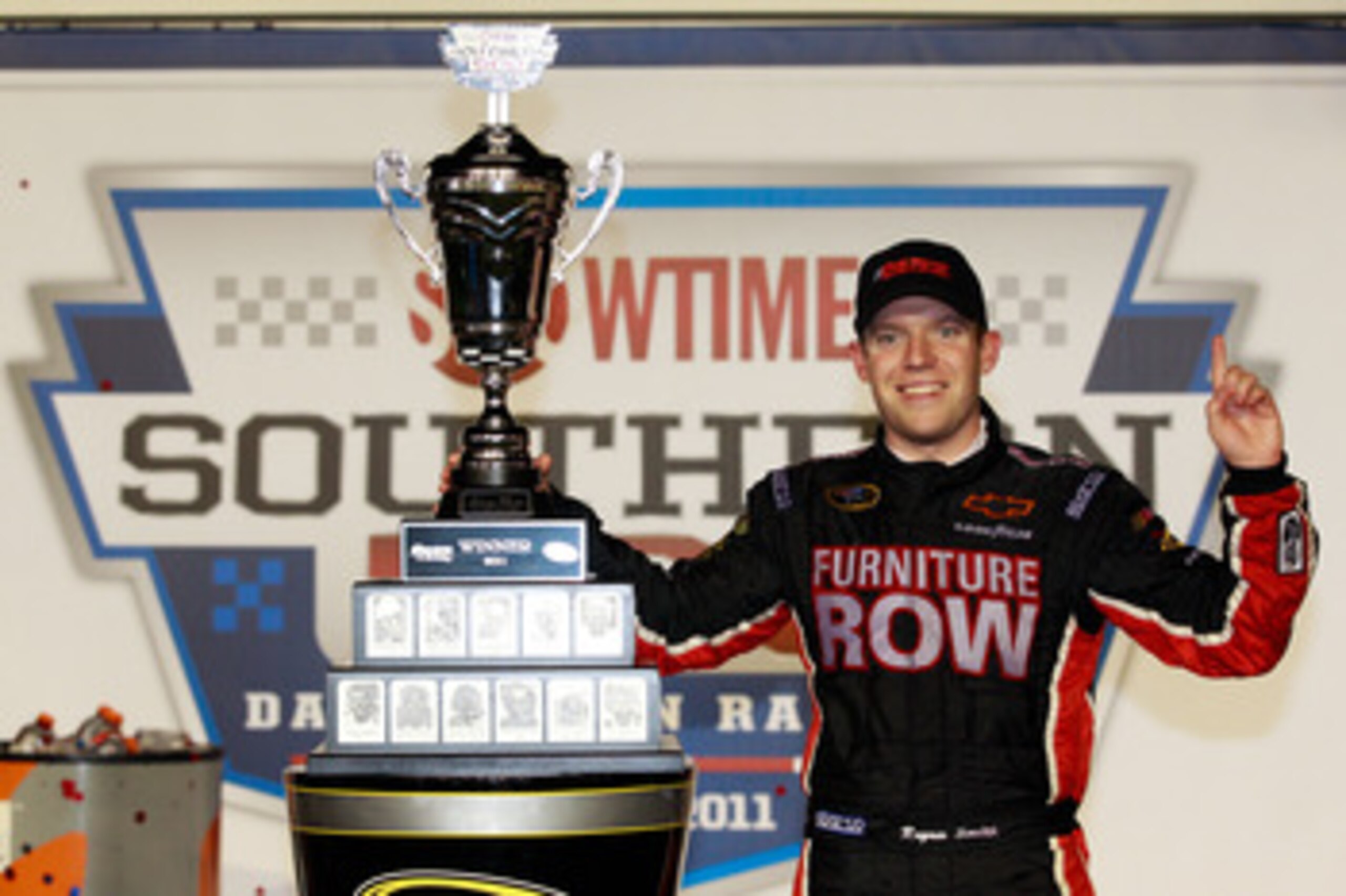 DARLINGTON, SC - MAY 07:  Regan Smith, driver of the #78 Furniture Row Companies Chevrolet, celebrates with in Victory Lane after winning the NASCAR Sprint Cup Series SHOWTIME Southern 500 at Darlington Raceway on May 7, 2011 in Darlington, South Carolina