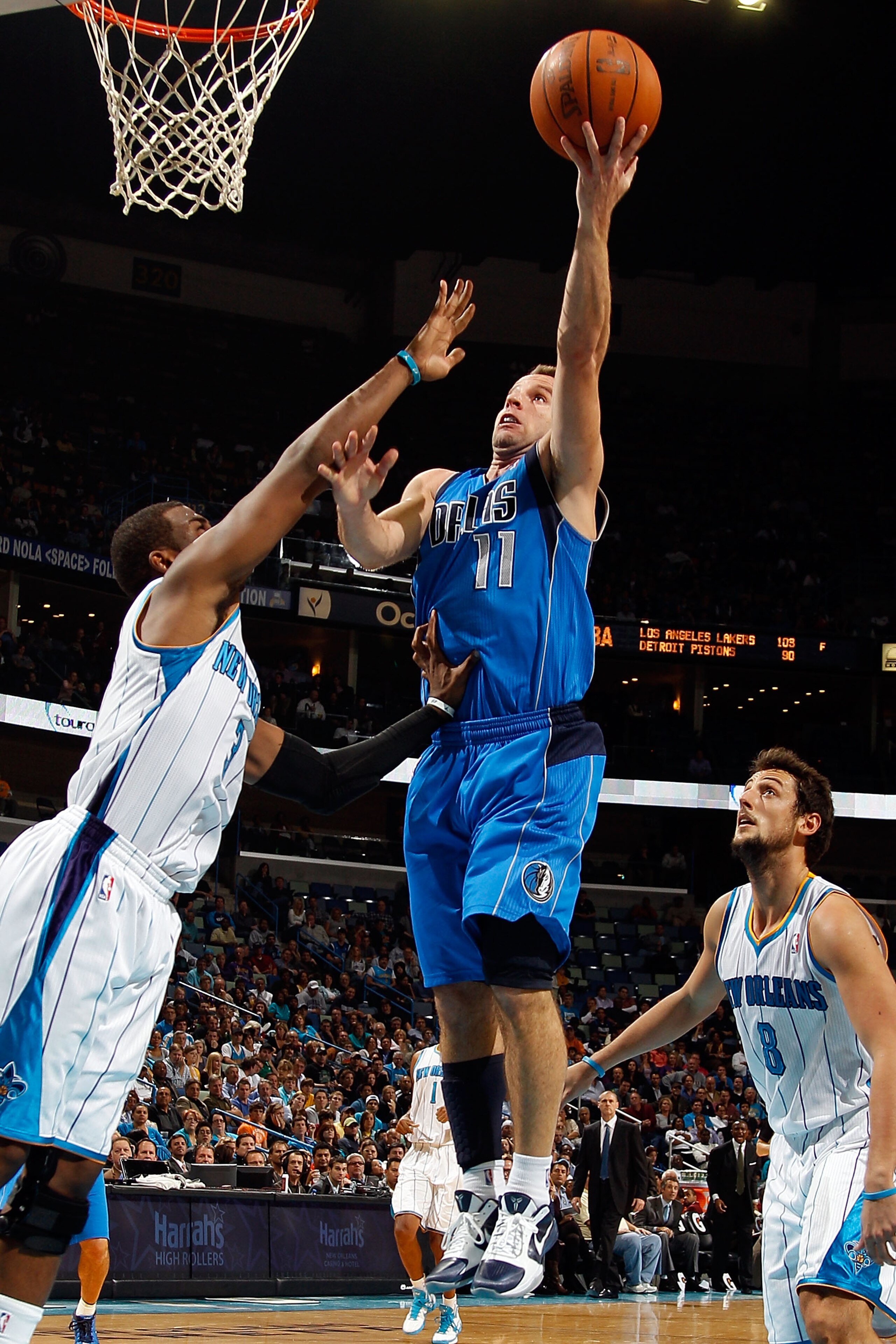 NEW ORLEANS - NOVEMBER 17:  Jose Barea #11 of the Dallas Mavericks shoots the ball  over Chris Paul #3 of the New Orleans Hornets at the New Orleans Arena on November 17, 2010 in New Orleans, Louisiana.  The Hornets defeated the Mavericks 99-97.  NOTE TO 