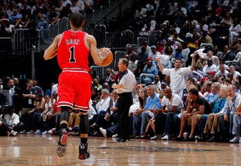 ATLANTA, GA - MAY 06:  Derrick Rose #1 of the Chicago Bulls runs the ball up the court against the Atlanta Hawks in Game Three of the Eastern Conference Semifinals in the 2011 NBA Playoffs at Phillips Arena on May 6, 2011 in Atlanta, Georgia.  NOTE TO USE