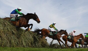 LIVERPOOL, ENGLAND - APRIL 09:  Comply Or Die ridden by Timmy Murphy (21), Don't Push It ridden by A.P McCoy (1) and The Midnight Club ridden by Ruby Walsh (11) all clear 'The Chair' during The John Smith's Grand National Steeple Chase at Aintree Racecour
