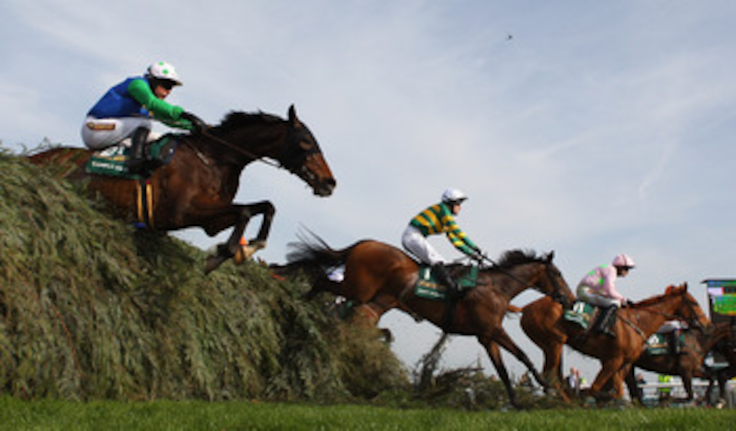 LIVERPOOL, ENGLAND - APRIL 09:  Comply Or Die ridden by Timmy Murphy (21), Don't Push It ridden by A.P McCoy (1) and The Midnight Club ridden by Ruby Walsh (11) all clear 'The Chair' during The John Smith's Grand National Steeple Chase at Aintree Racecour