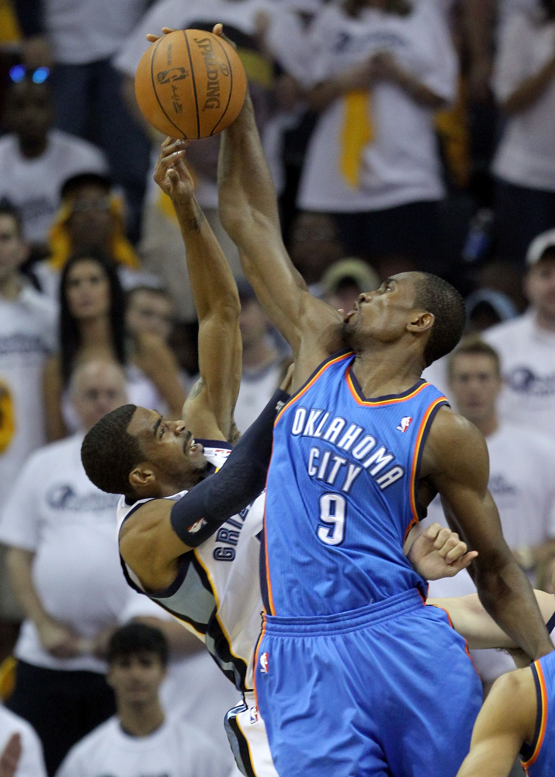 MEMPHIS, TN - MAY 07:  Serge Ibaka #9 of the Oklahoma City Thunder blocks the shot of Mike Conley #11 of the Memphis Grizzlies in Game Three of the Western Conference Semifinals in the 2011 NBA Playoffs at FedExForum on May 7, 2011 in Memphis, Tennessee.