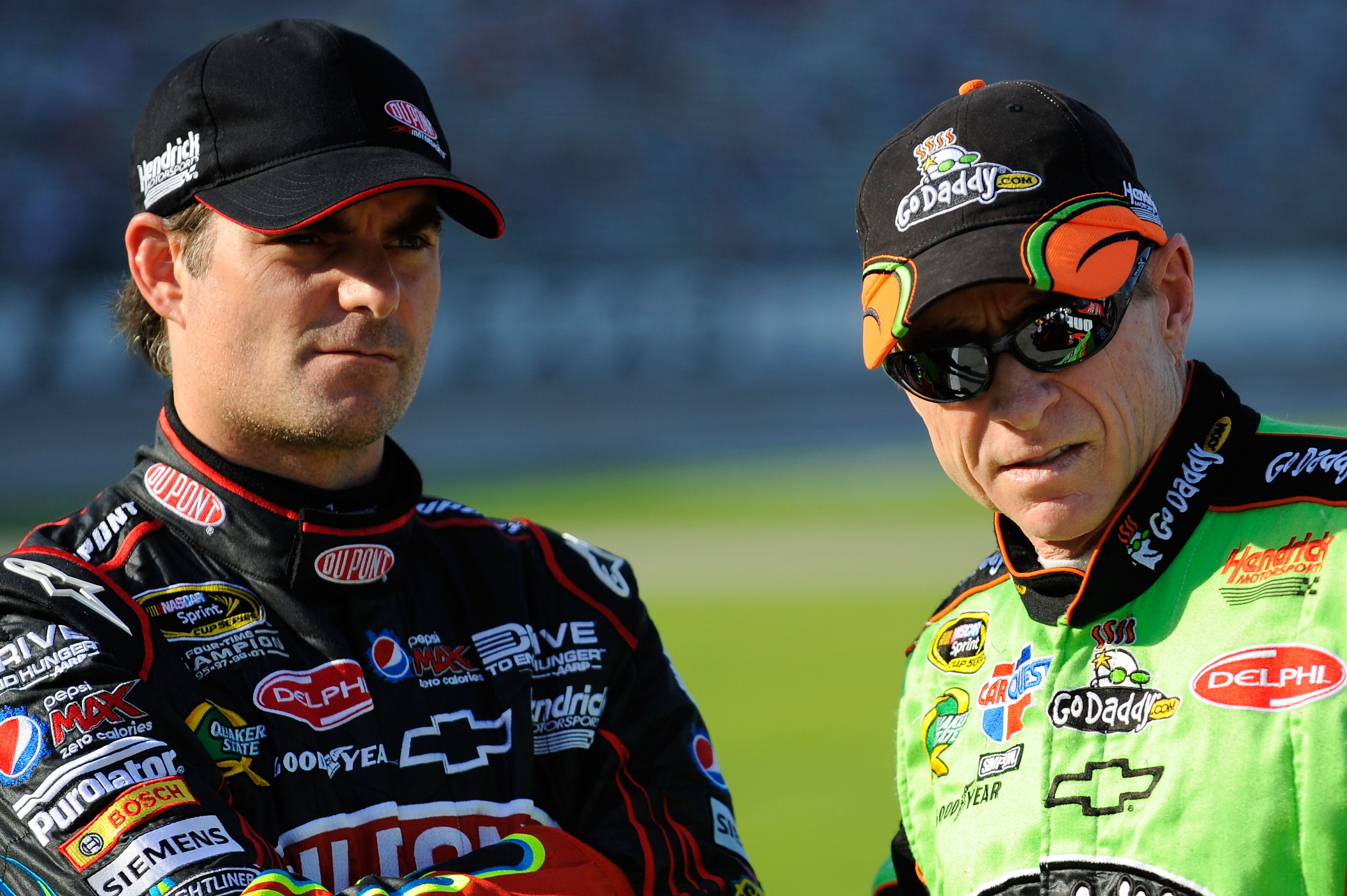 FORT WORTH, TX - APRIL 08:  Jeff Gordon (L), driver of the #24 DuPont Chevrolet, talks with Mark Martin (R), driver of the #5 GoDaddy.com Chevrolet, on the grid during qualifying for the NASCAR Sprint Cup Series Samsung Mobile 500 at Texas Motor Speedway